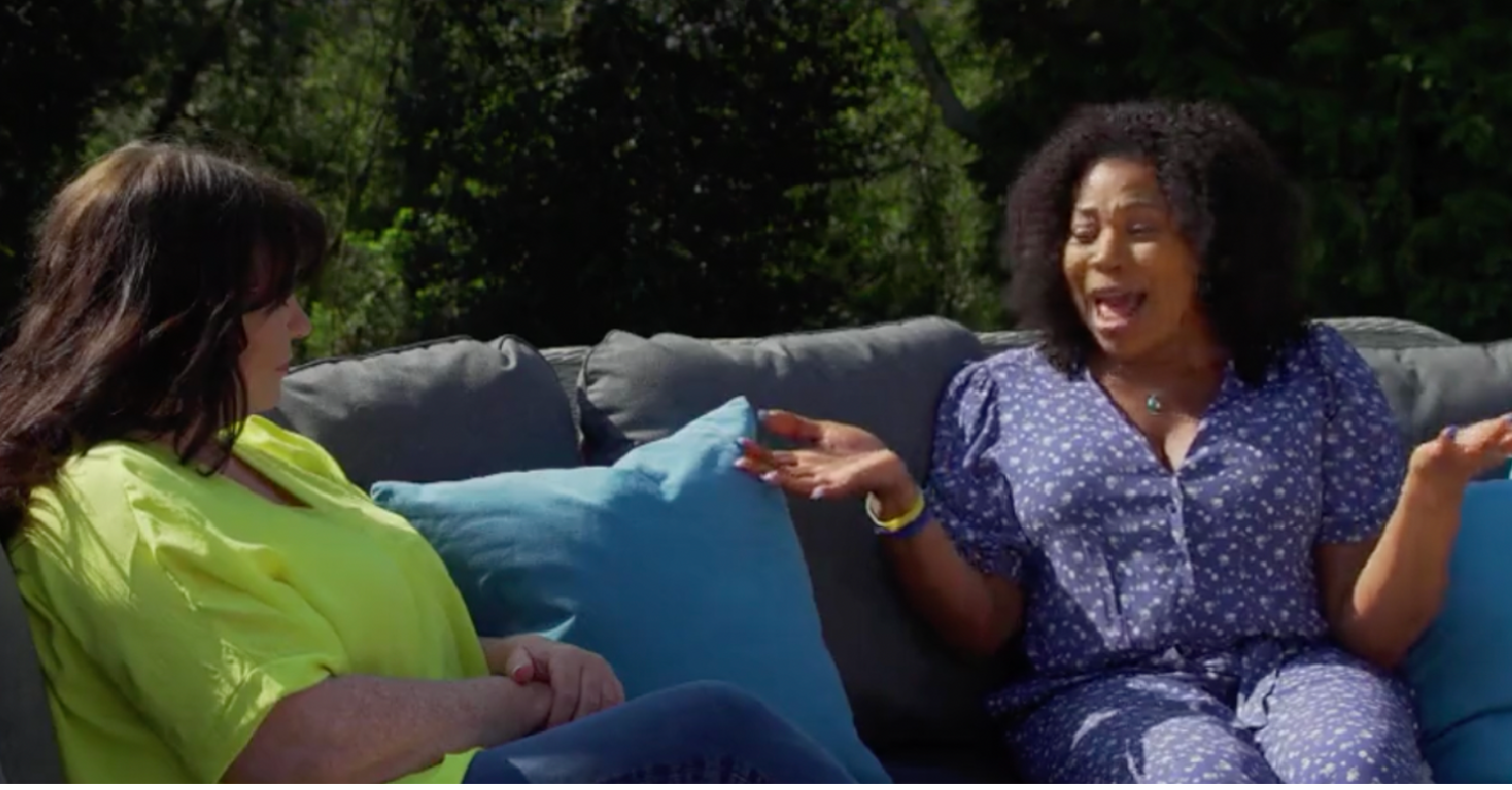Loose Women stars Brenda Edwards and Coleen Nolan talking on a sofa outside 