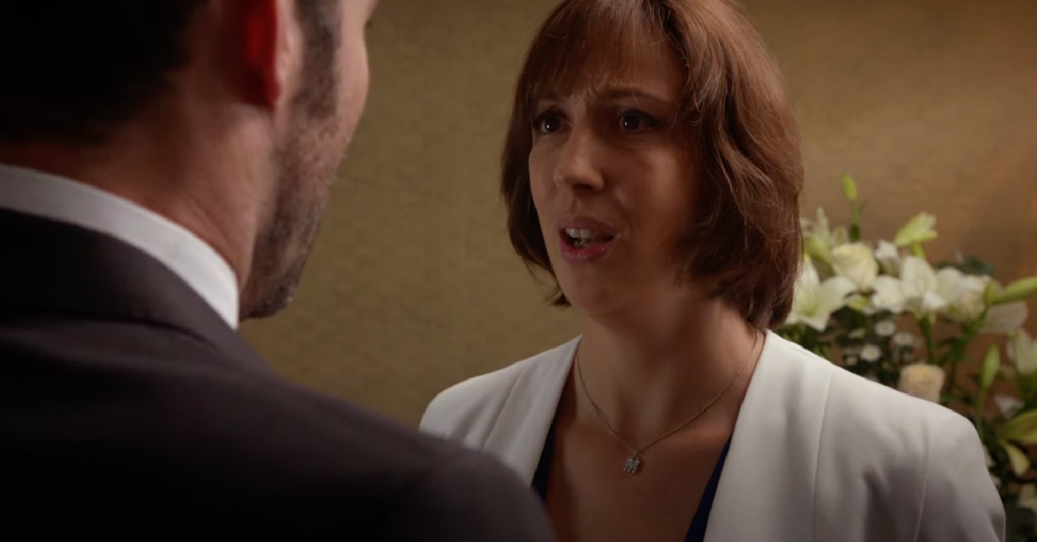 Miranda Hart talking to Tom Ellis in character white coat