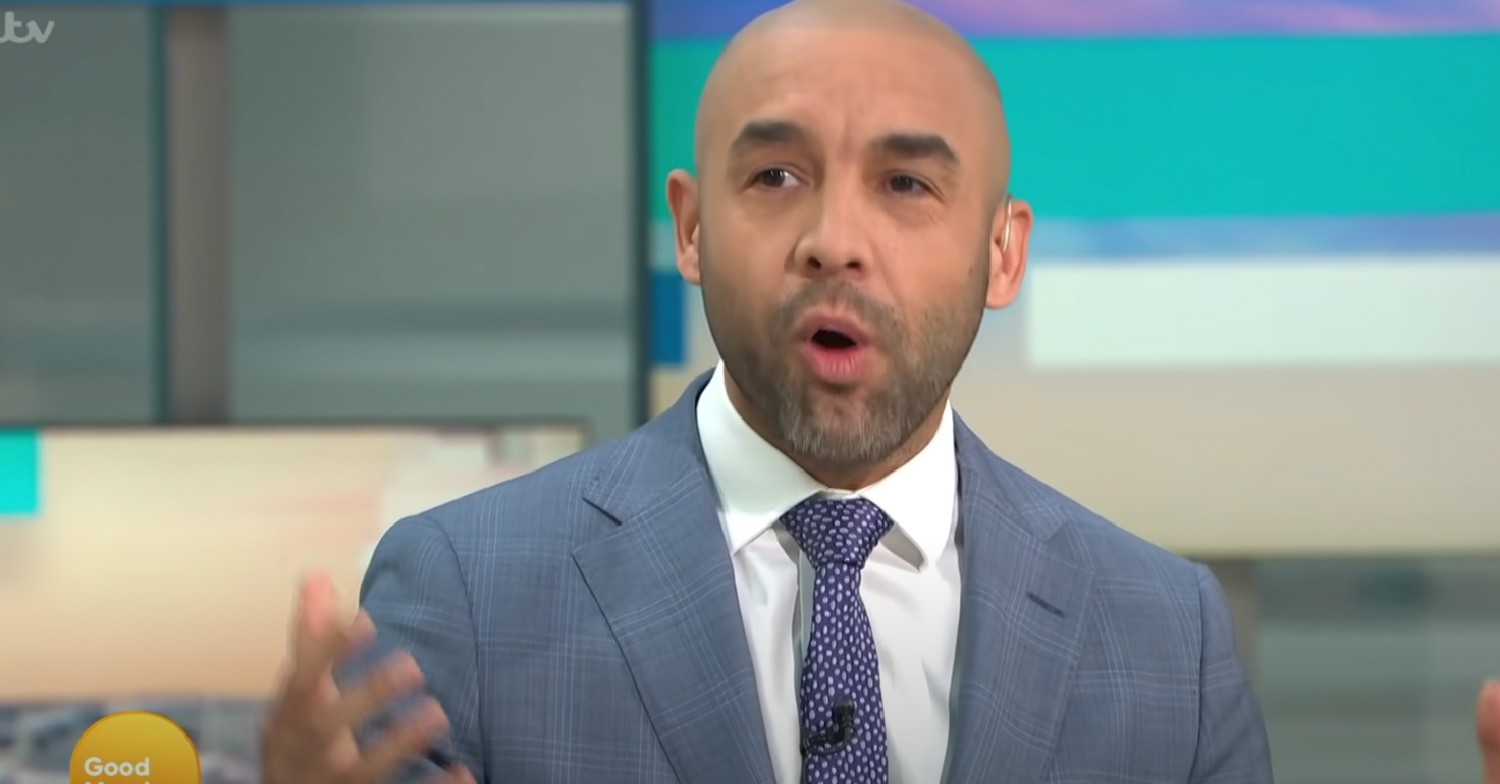 Alex Beresford on GMB in grey suit mid-argument