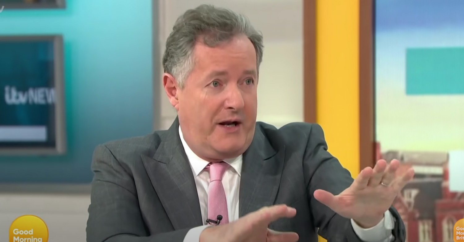 Piers Morgan in grey suit arguing on GMB