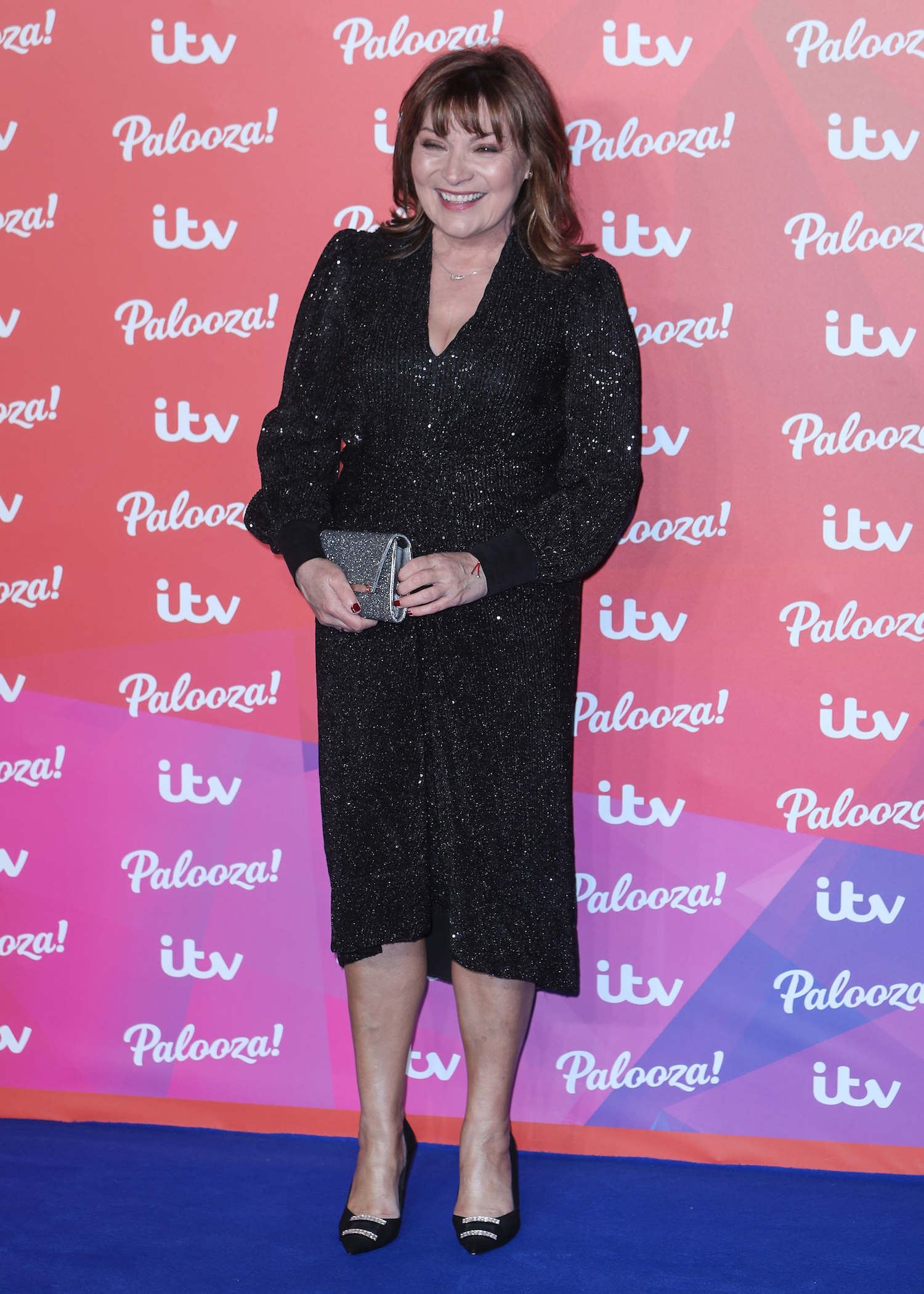 Lorraine Kelly smiles in black dress at ITV Palooza