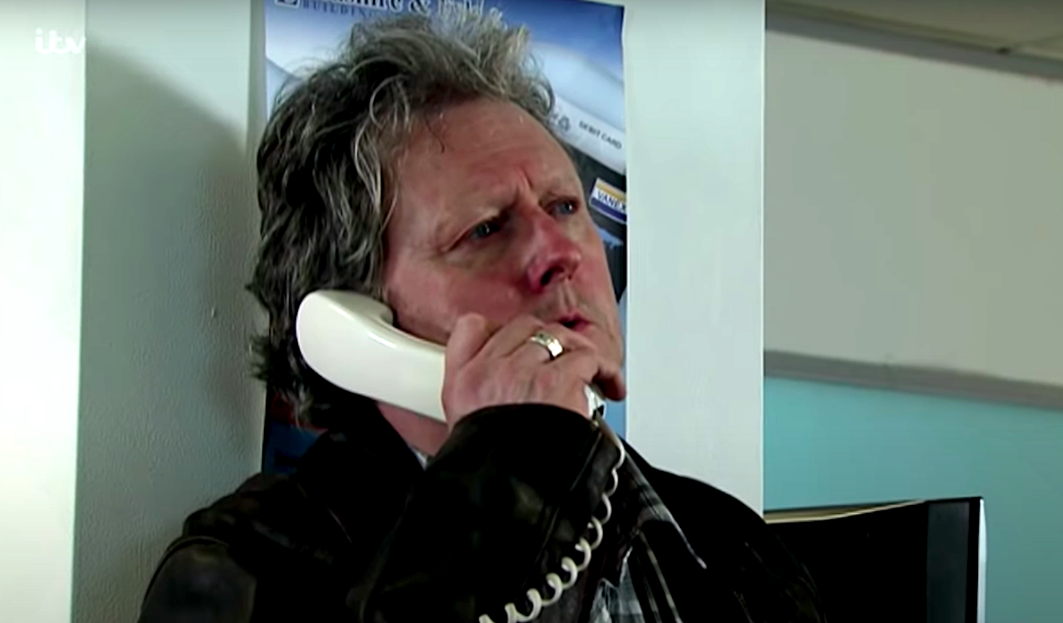 Jim McDonald on the phone during his armed robbery in Coronation Street