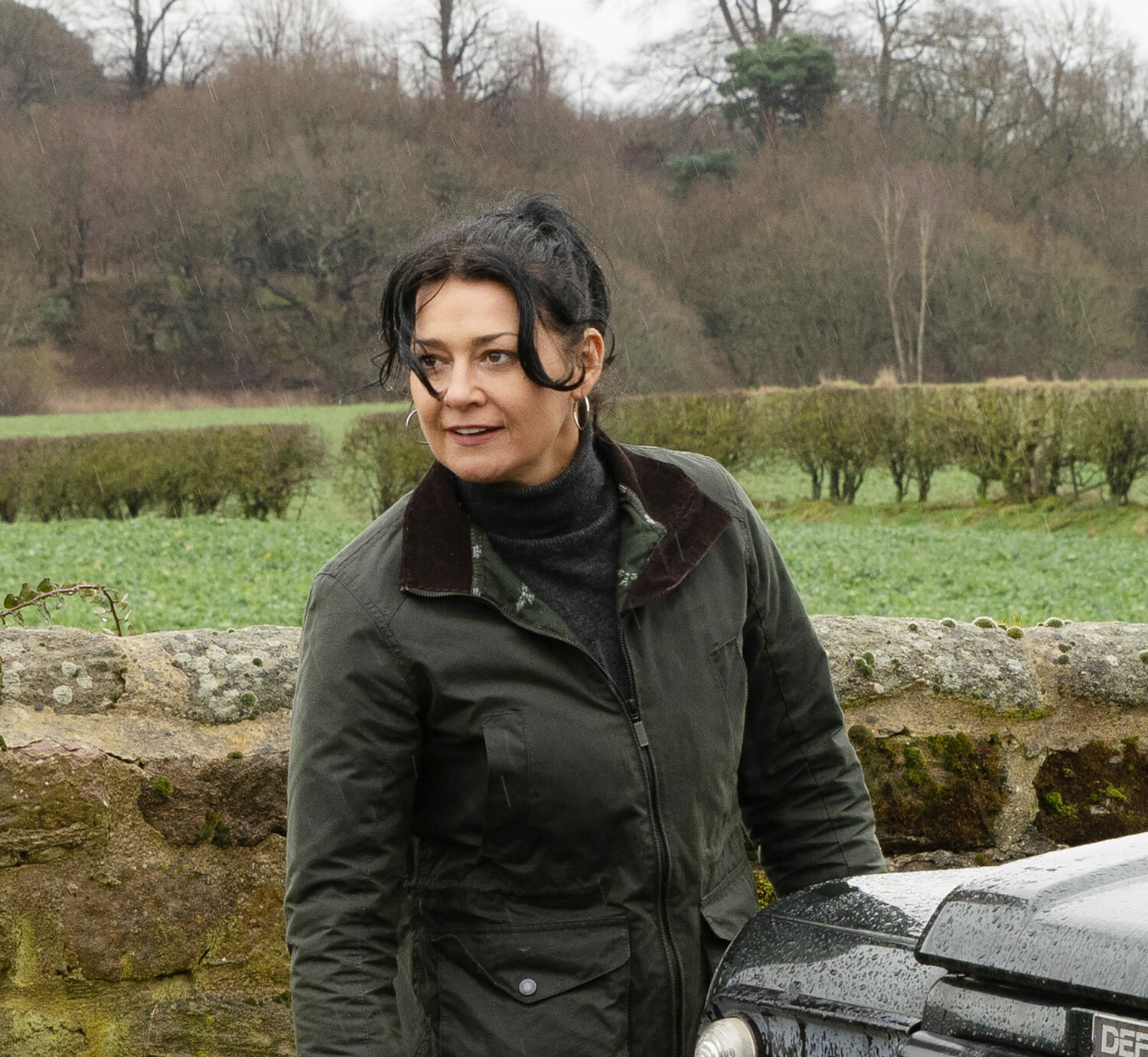 Moira Dingle looking angry as she stands by her car
