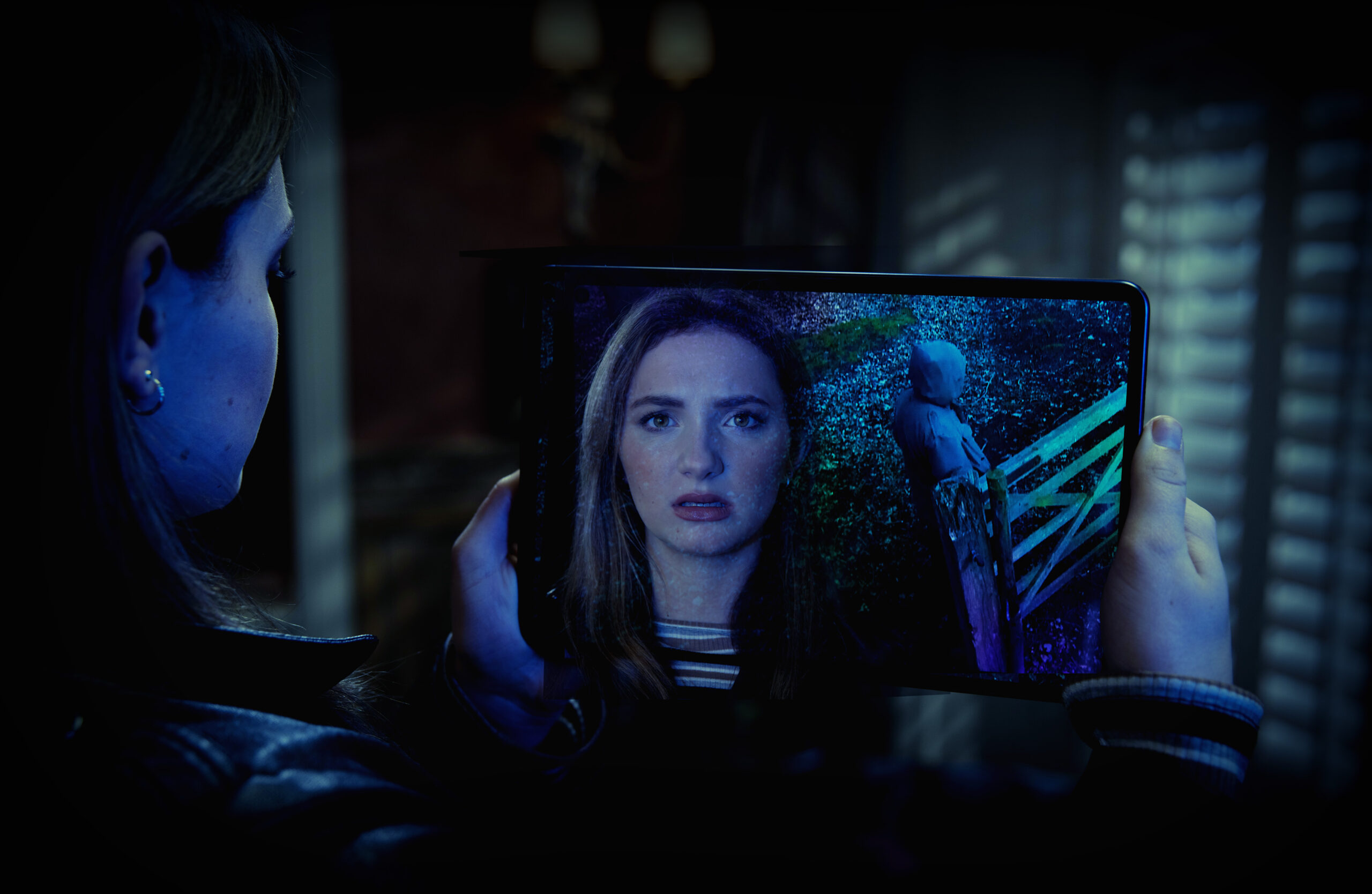 Gabby looking at a hooded figure in Emmerdale 