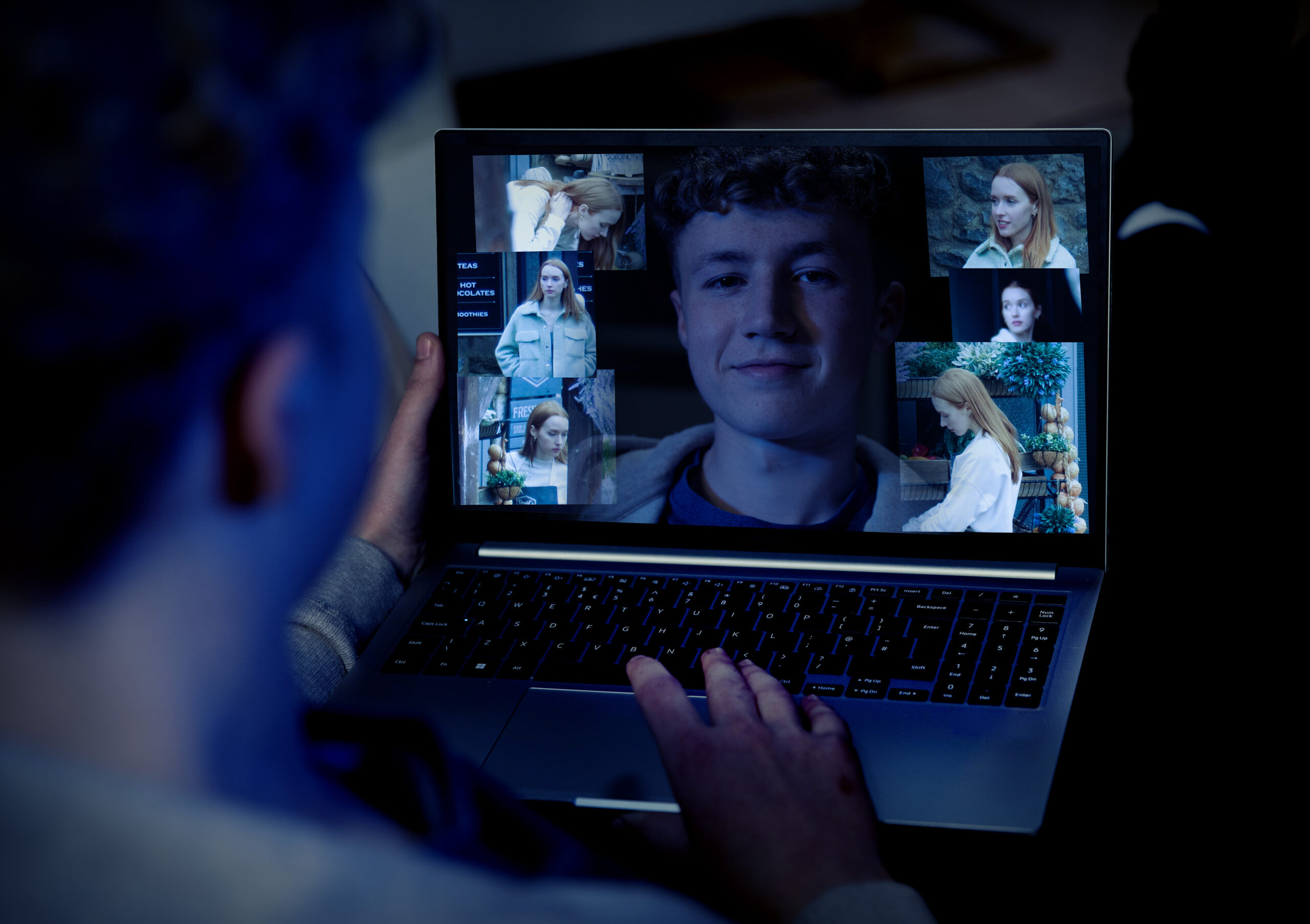 Noah looking at pictures of Chloe on his laptop in Emmerdale 