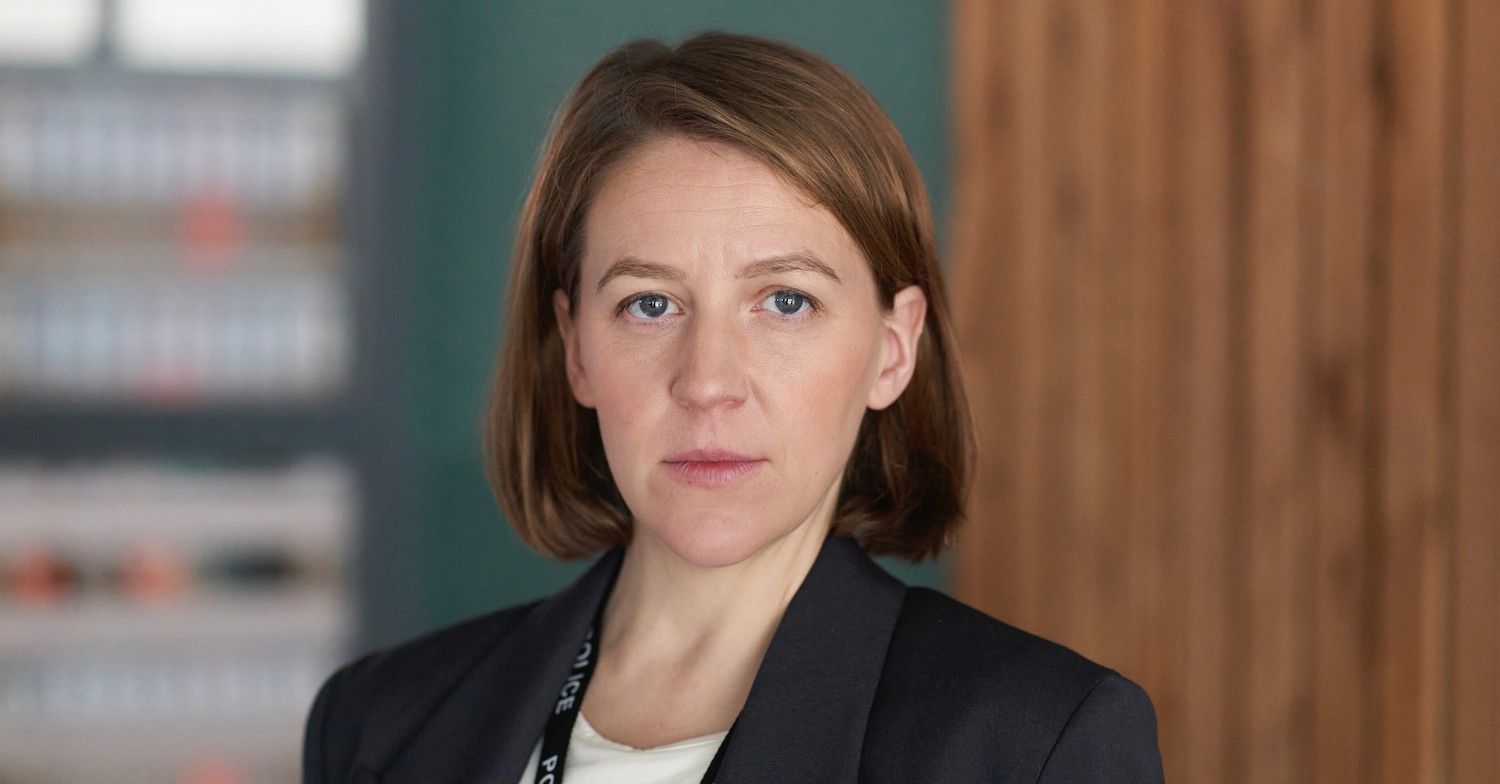 Gemma Whelan in DI Ray dressed in a suit looking to camera