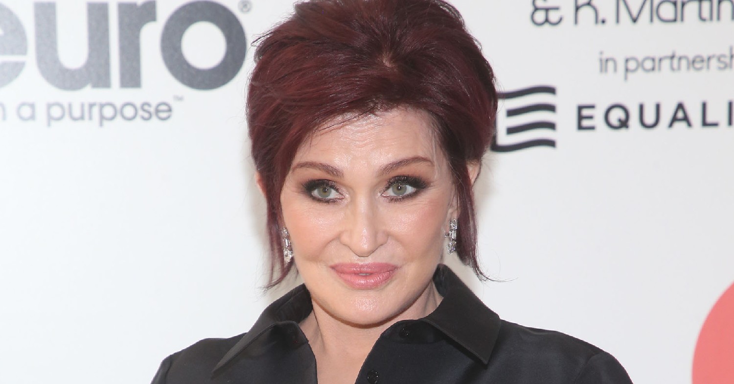 Sharon Osbourne smiling in black outfit at event