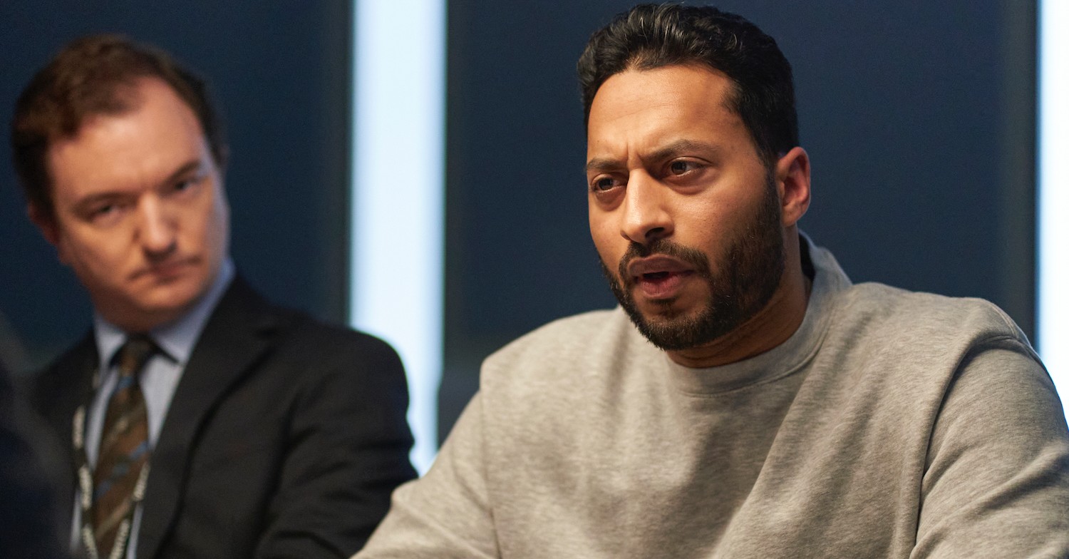 Suspect looking angry with lawyer