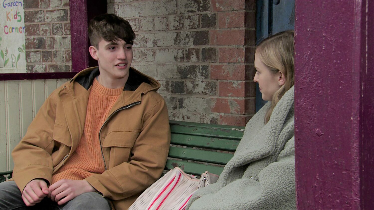 Coronation Street Aaron and Summer talk on a bench in Victoria Garden