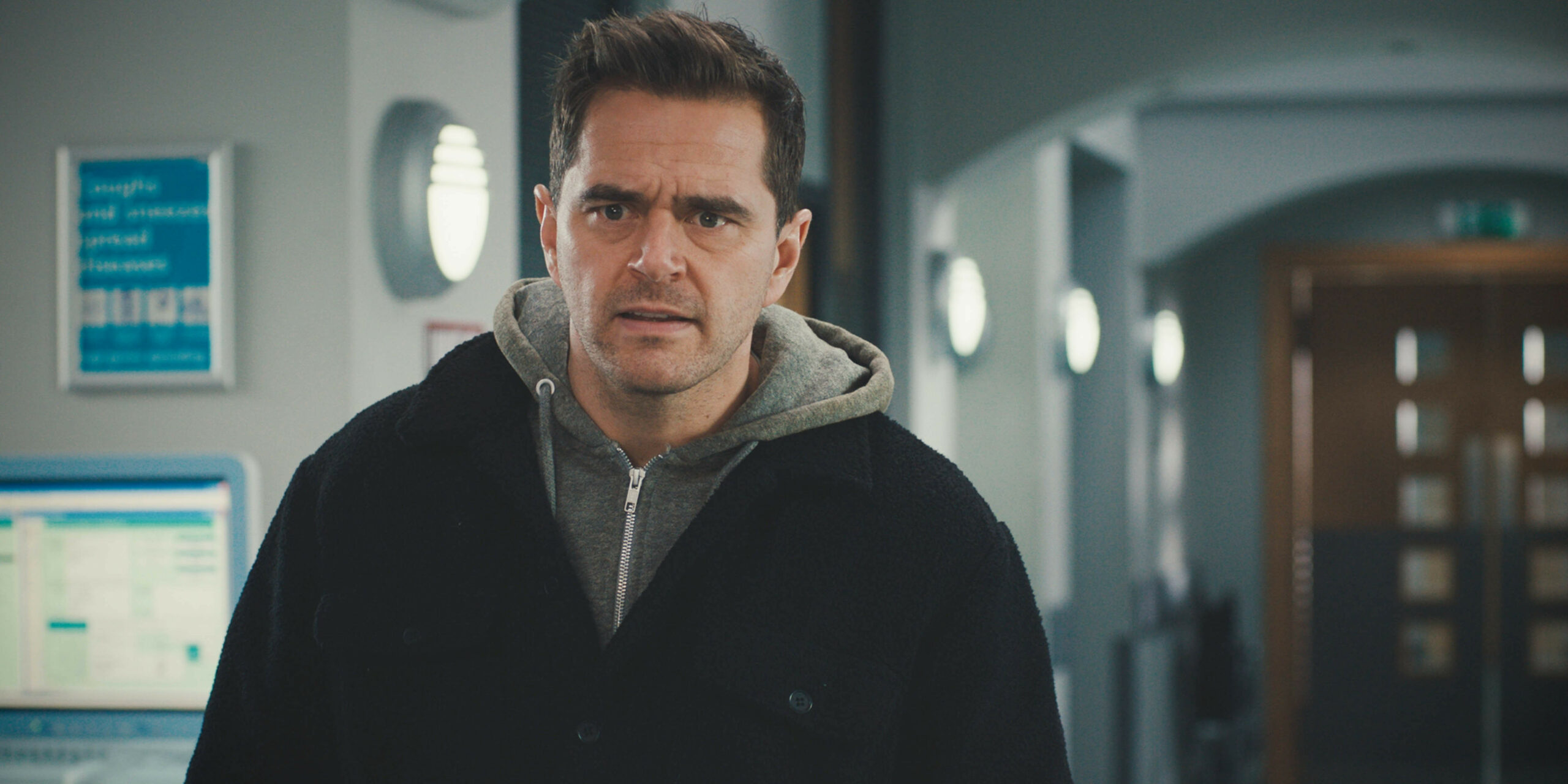 Casualty character Iain Dean looking moody