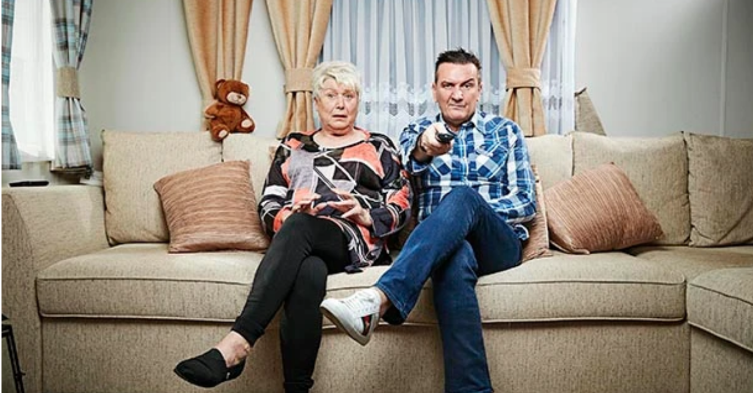 Jenny and Lee, Lee points the remote as Jenny looks disguated on Gogglebox