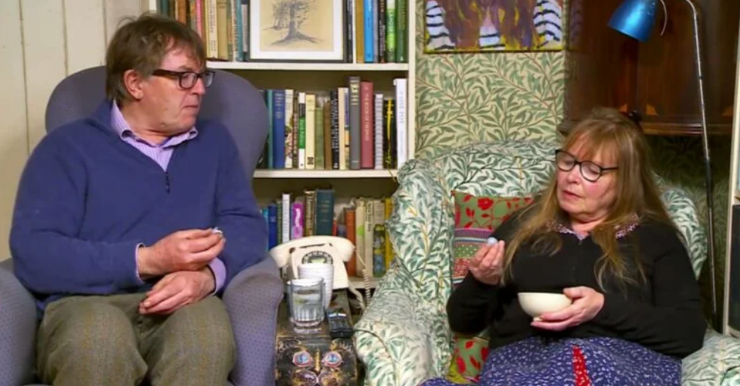 Gogglebox Giles looks at his wife Mary as she inspects something from a bowl