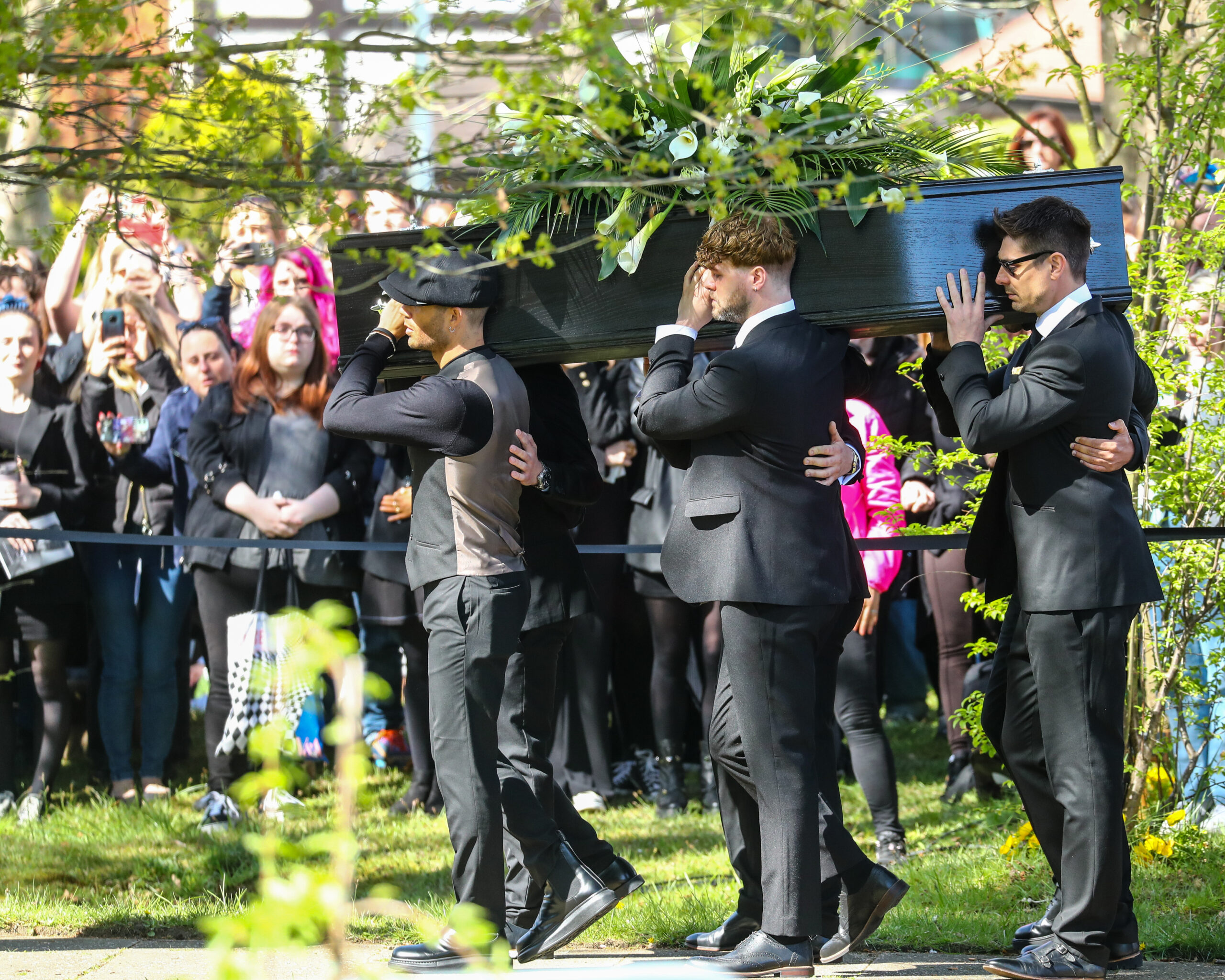 The Wanted stars carry Tom Parker's coffin