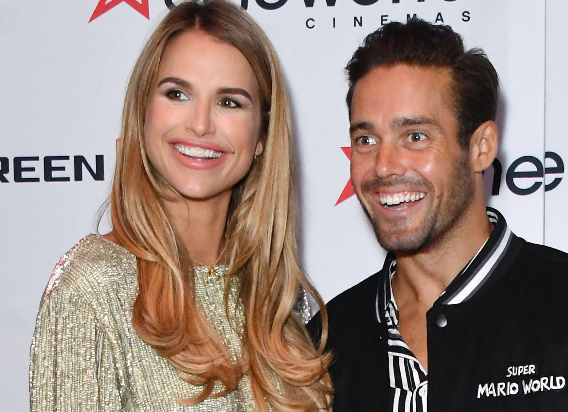 Vogue Williams and Spencer Matthew smile on the red carpet