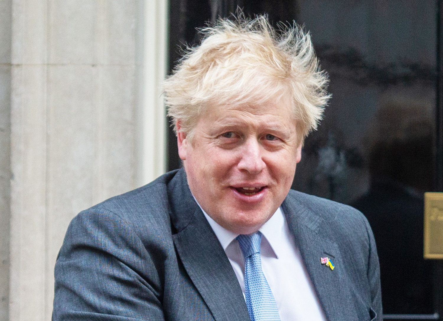 Boris Johnson smiles outside Downing Street 
