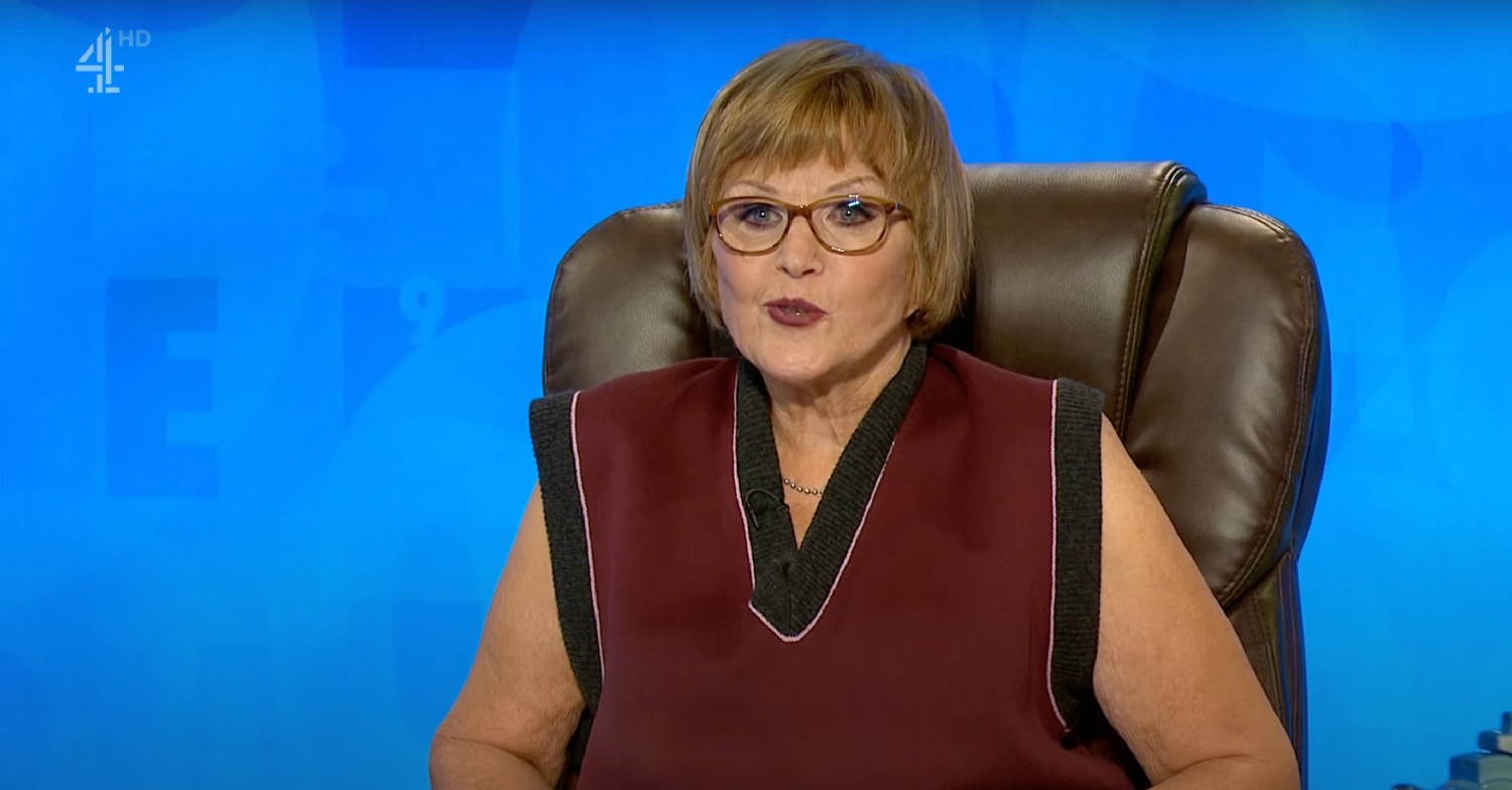 Anne Robinson in burgundy and black top on Countdown