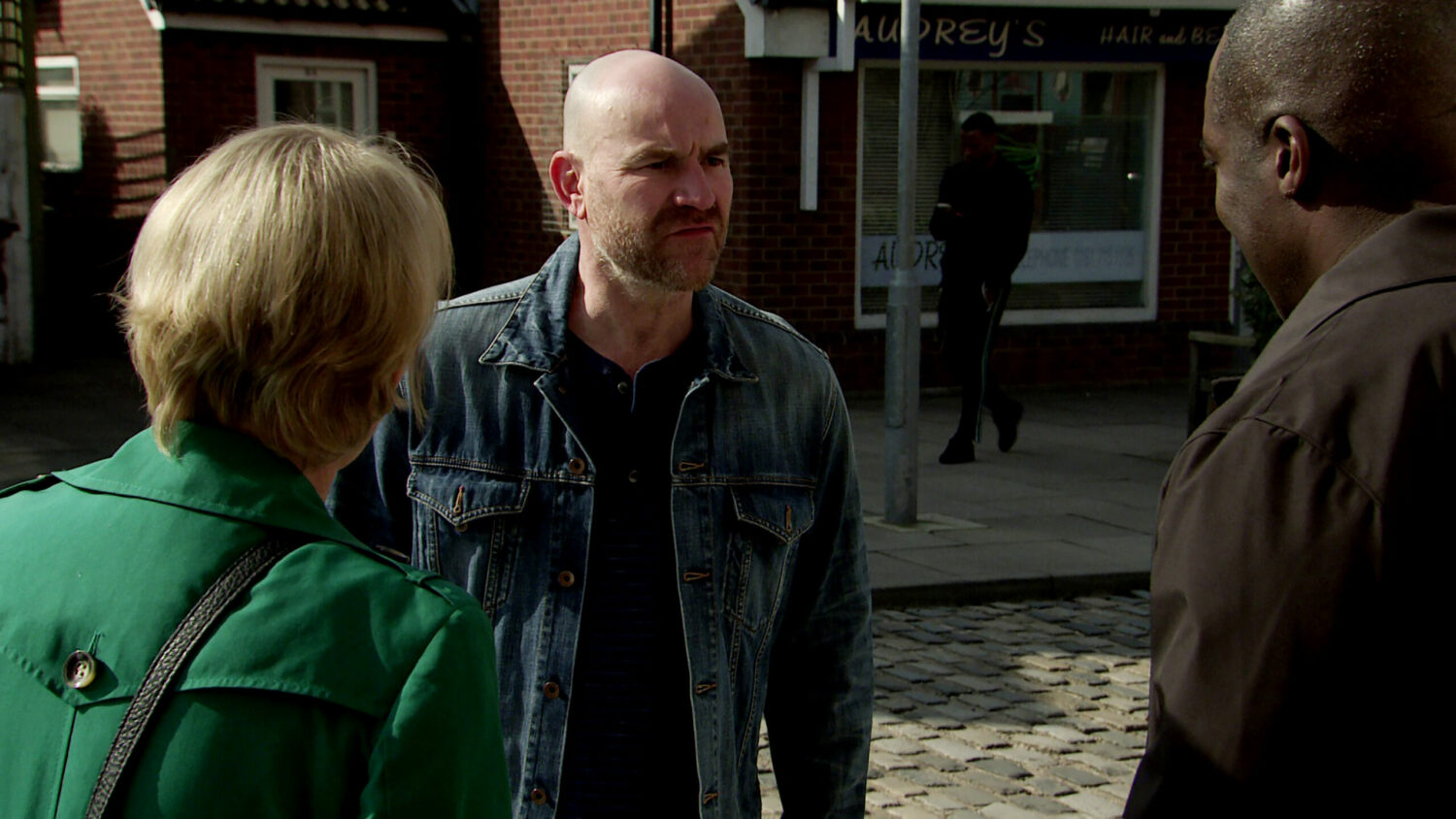 Corrie Tim is fuming and crosses the road when he sees Sally and Ronnie talking