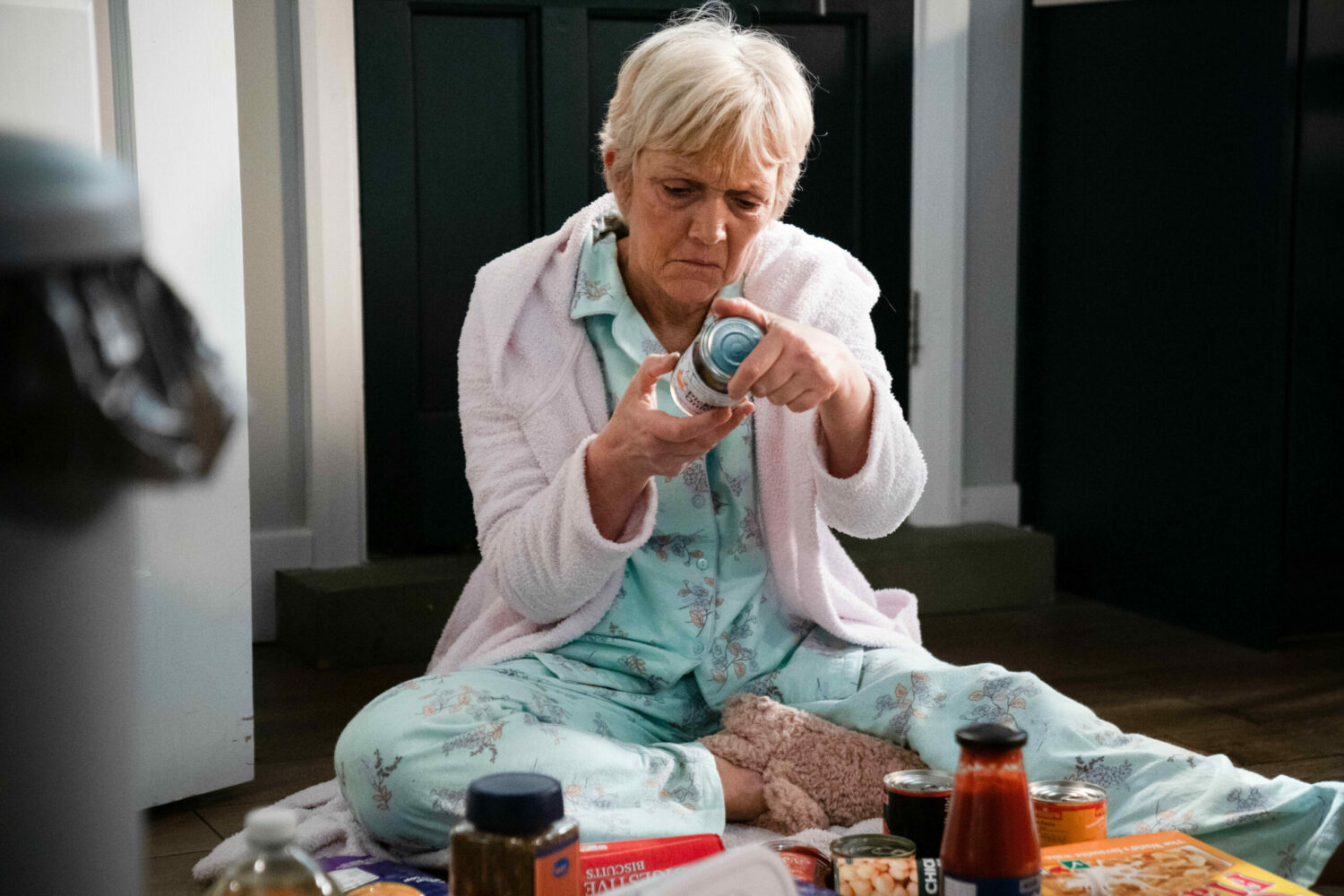 EastEnders troubled Jean Slater sits on the floor looking at pills