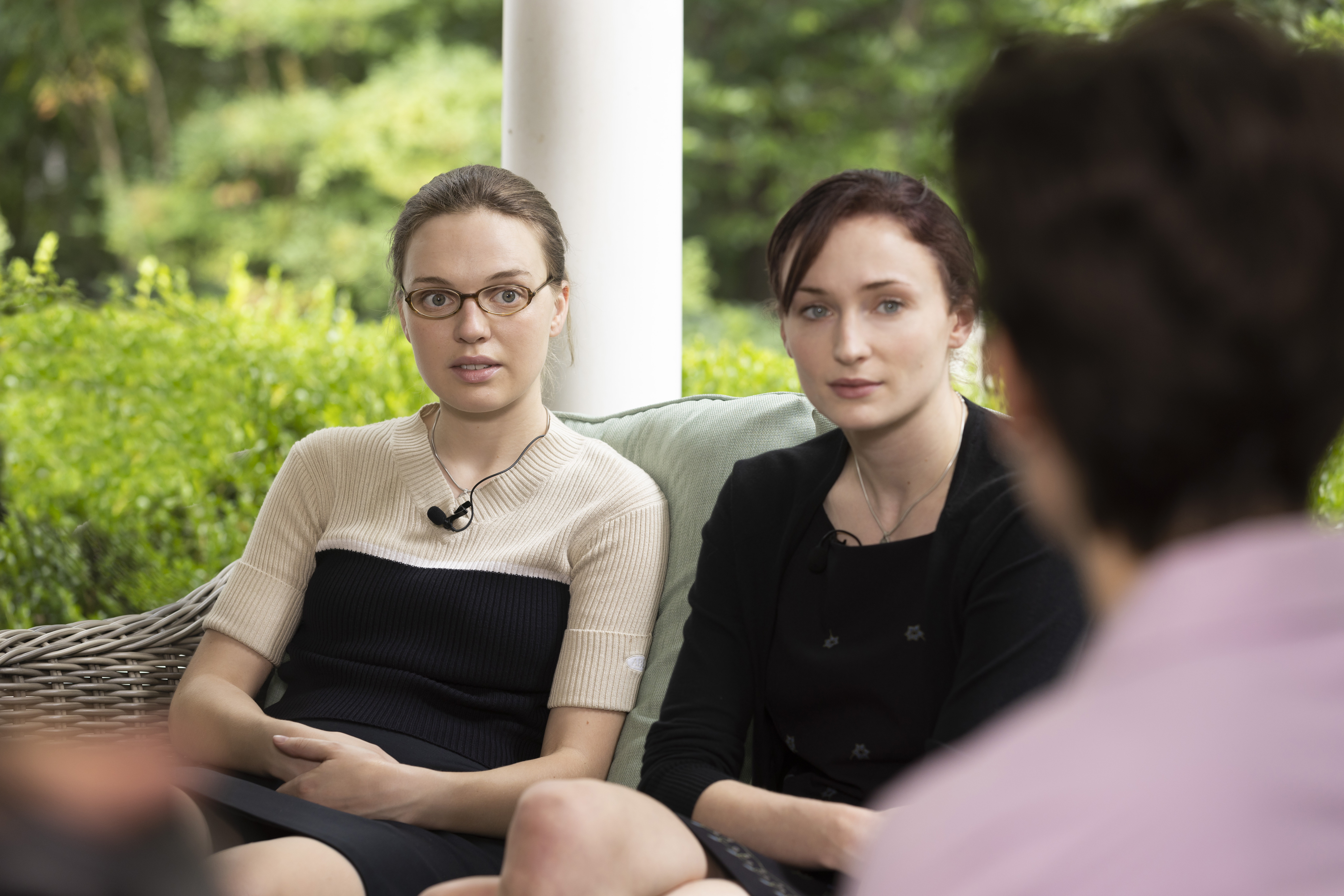 Two girls looking scared in The Staircase