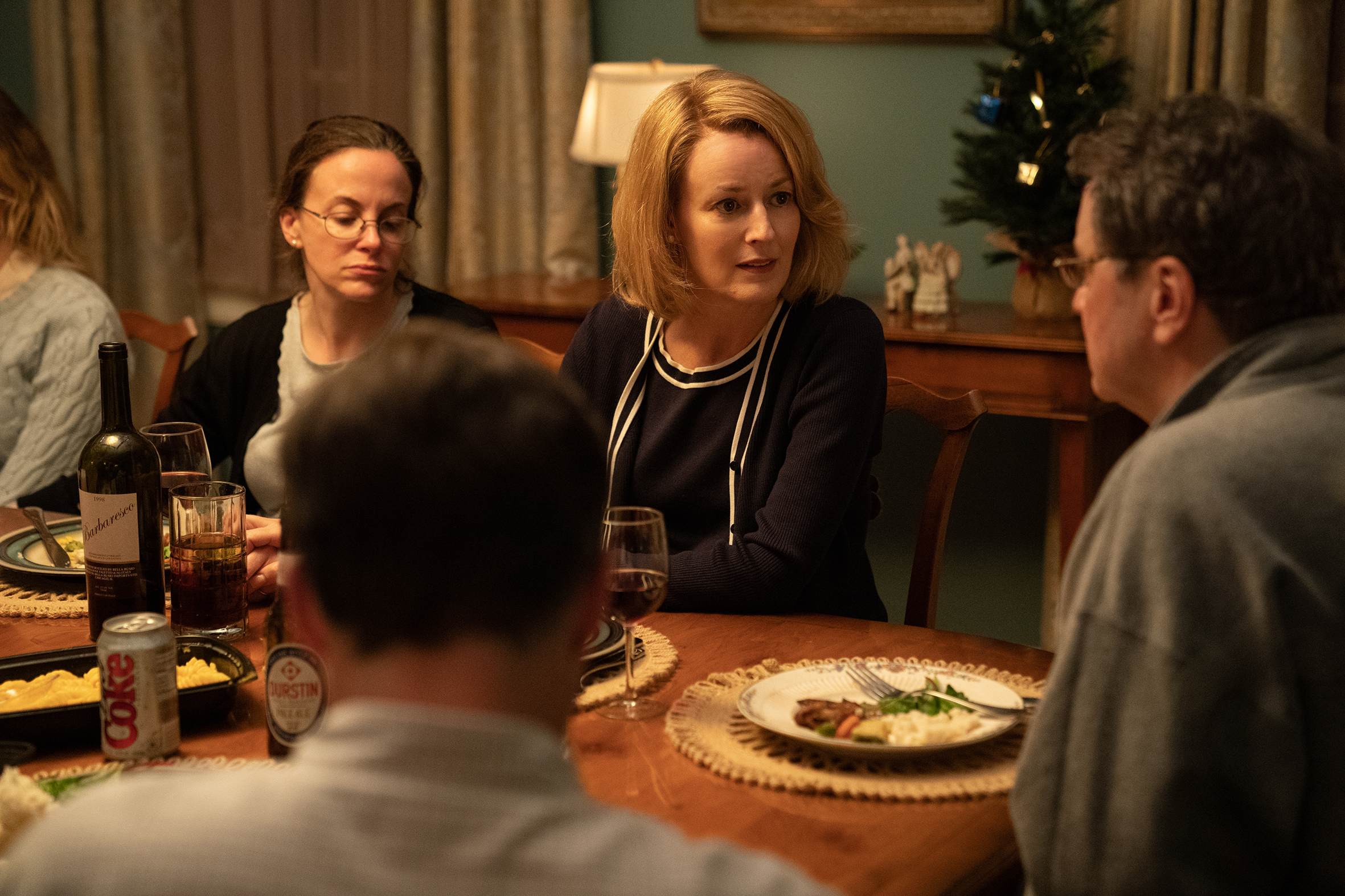 Woman eating dinner in The Staircase