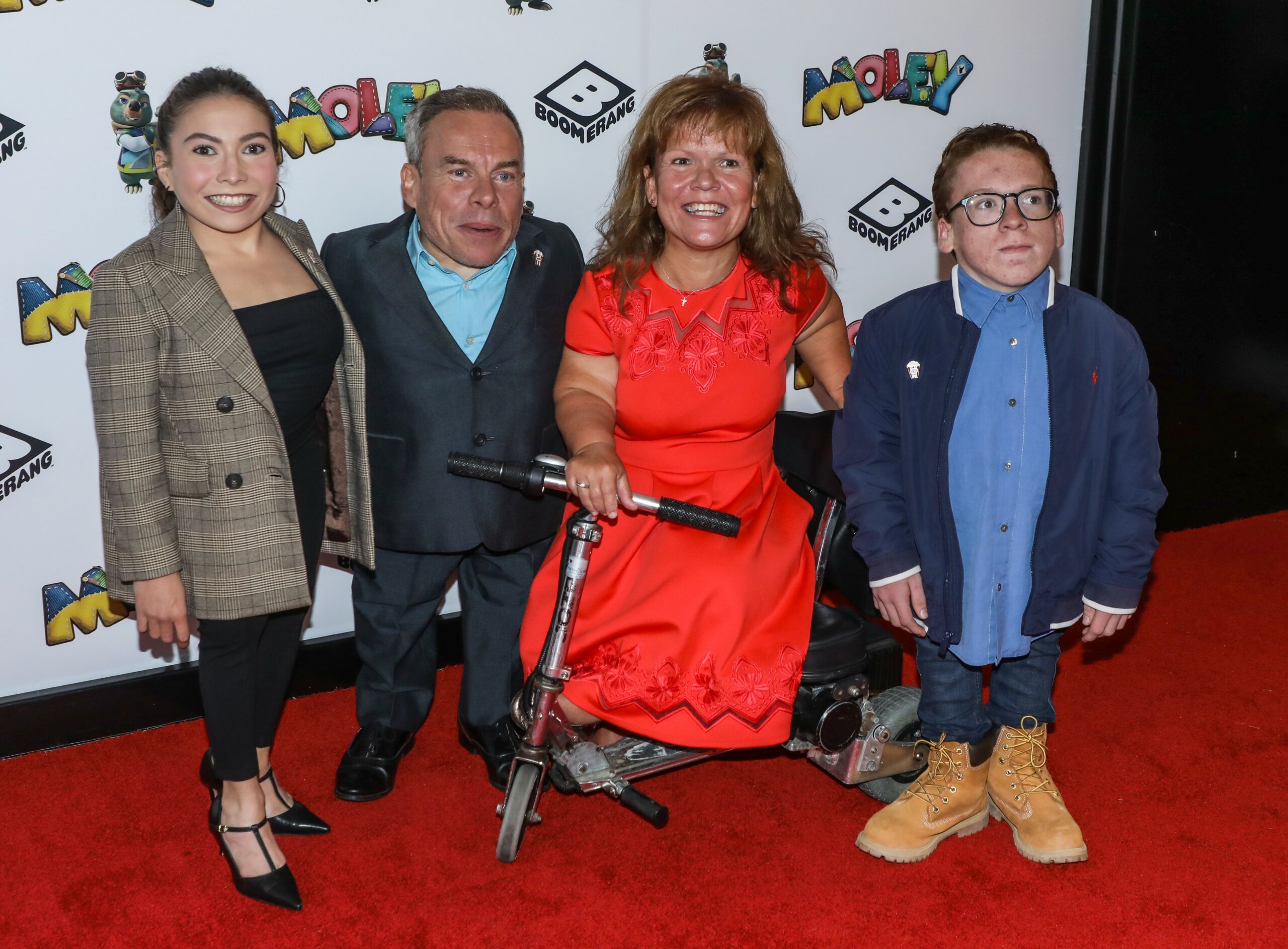 Warwick Davis with his wife and children