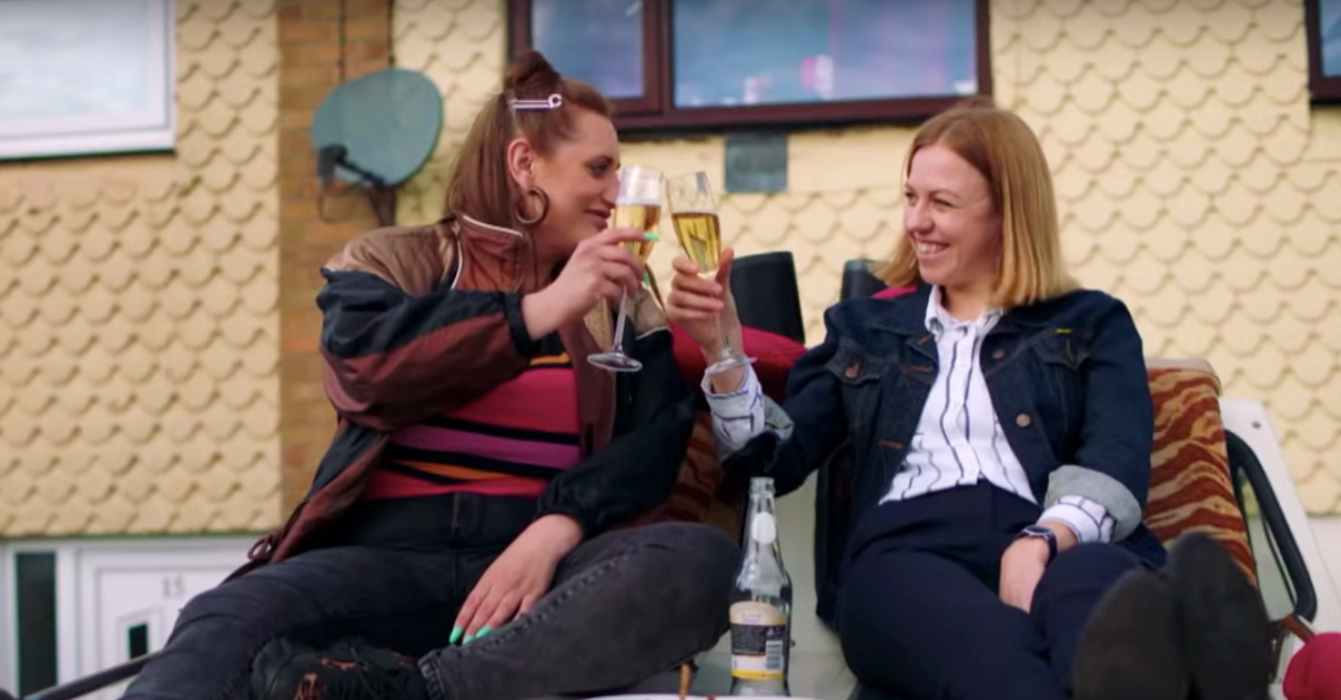 Ellie White and Lauren Socha with glasses of champagne on The Other One