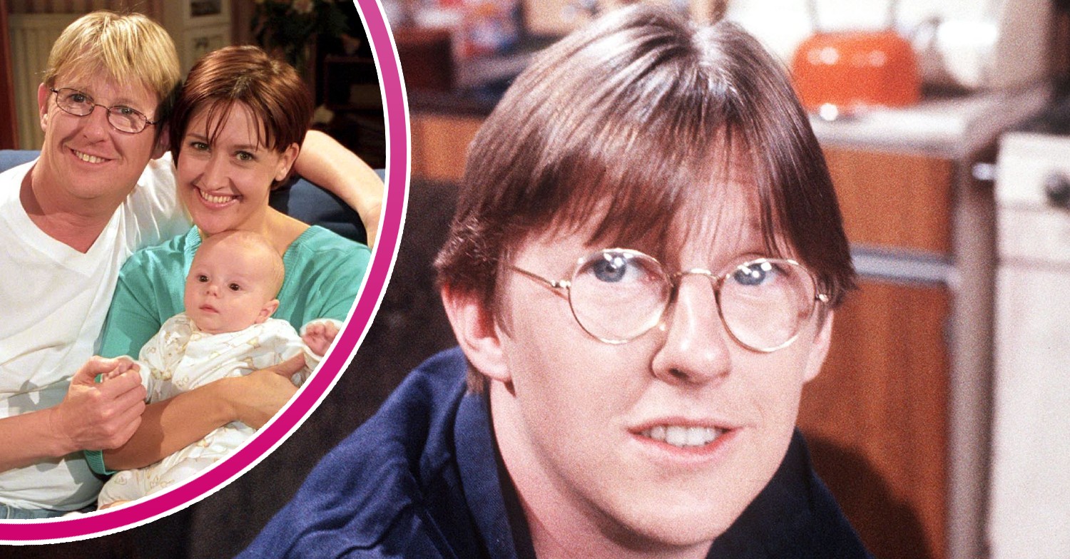 Curly with his wife Emma and son Ben smiling in Coronation Street