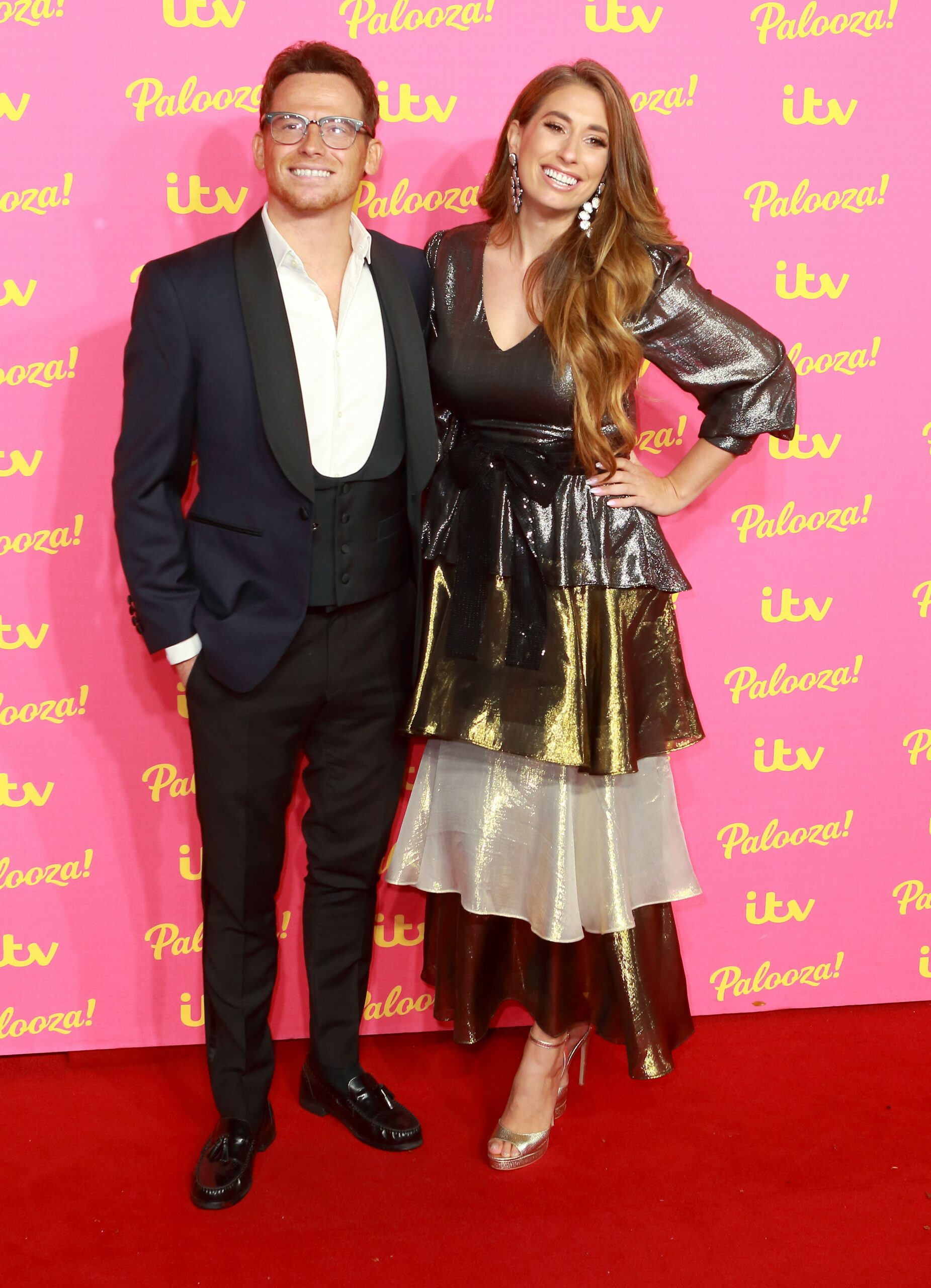 Joe Swash and Stacey Solmon smile on red carpet at ITV Palooza
