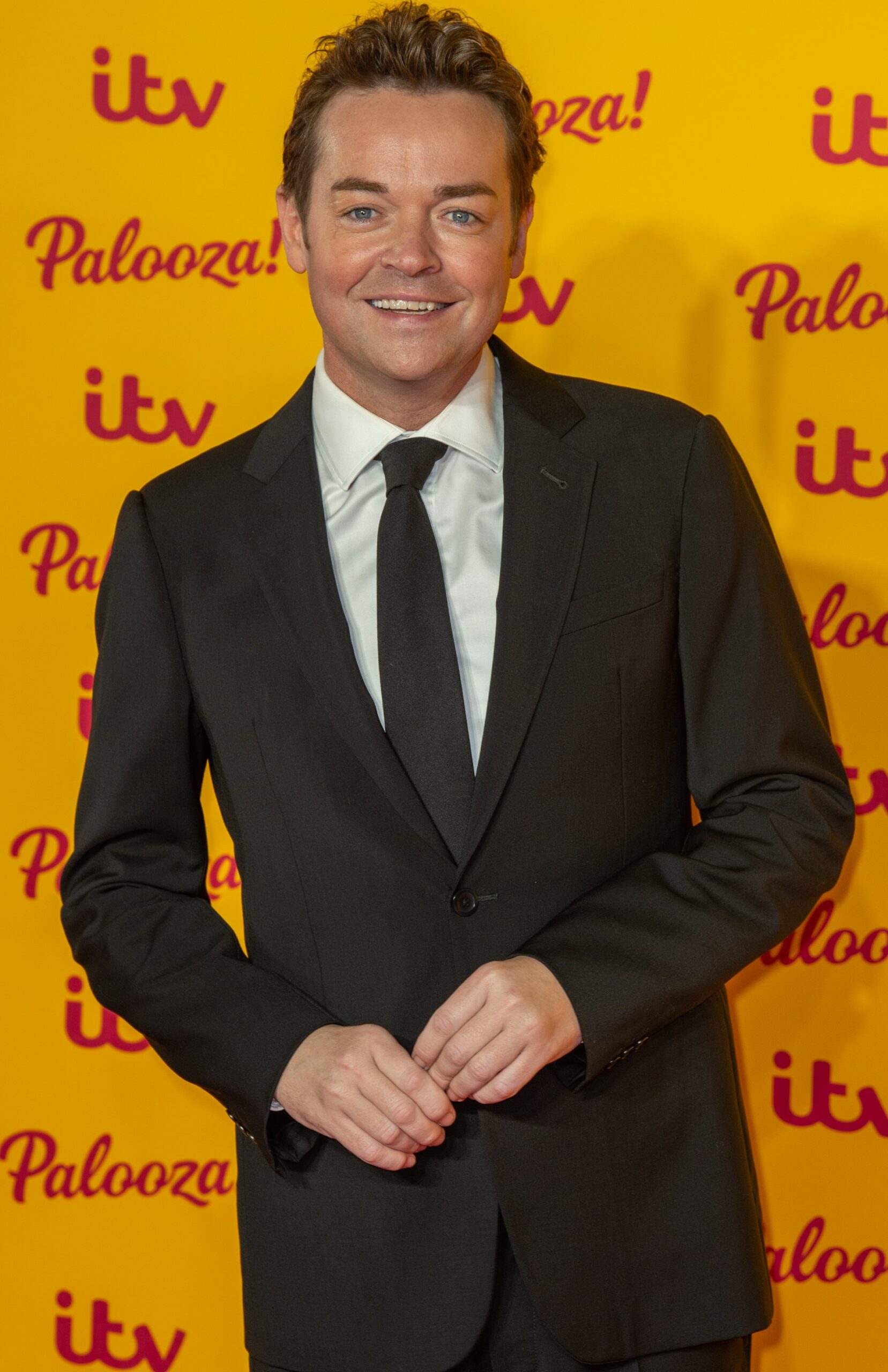 Stephen Mulhern in black suit at ITV Palooza