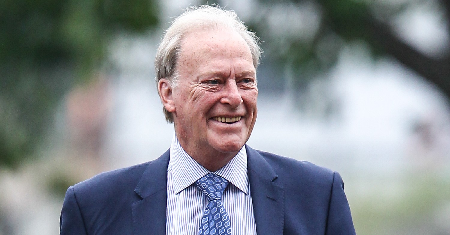 Dennis Waterman smiles in suit