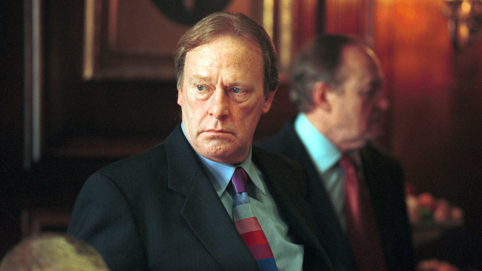 Actor Dennis Waterman looking solemn in New Tricks