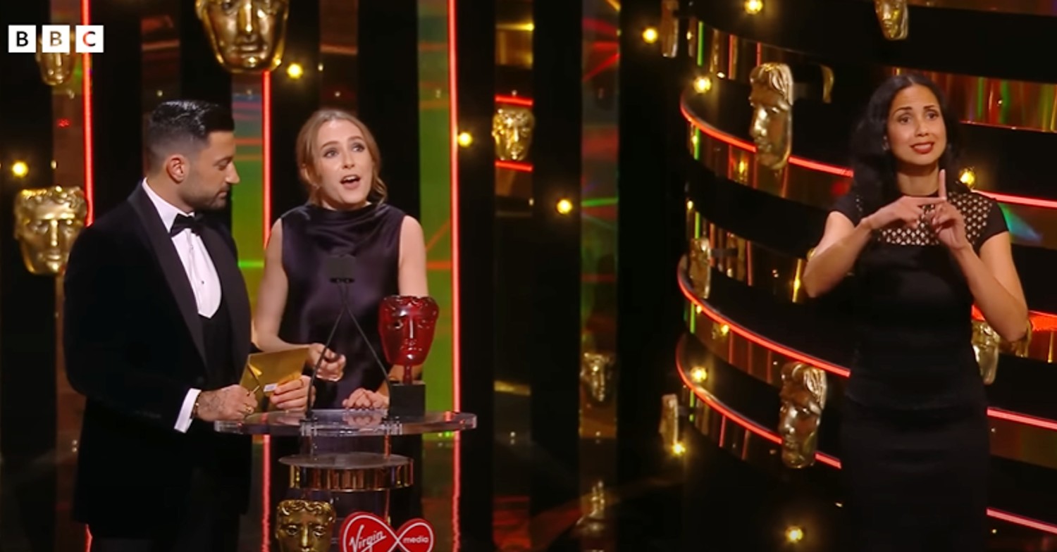 Rose Ayling-Ellis and Giovanni Pernice on stage at BAFTAs after win