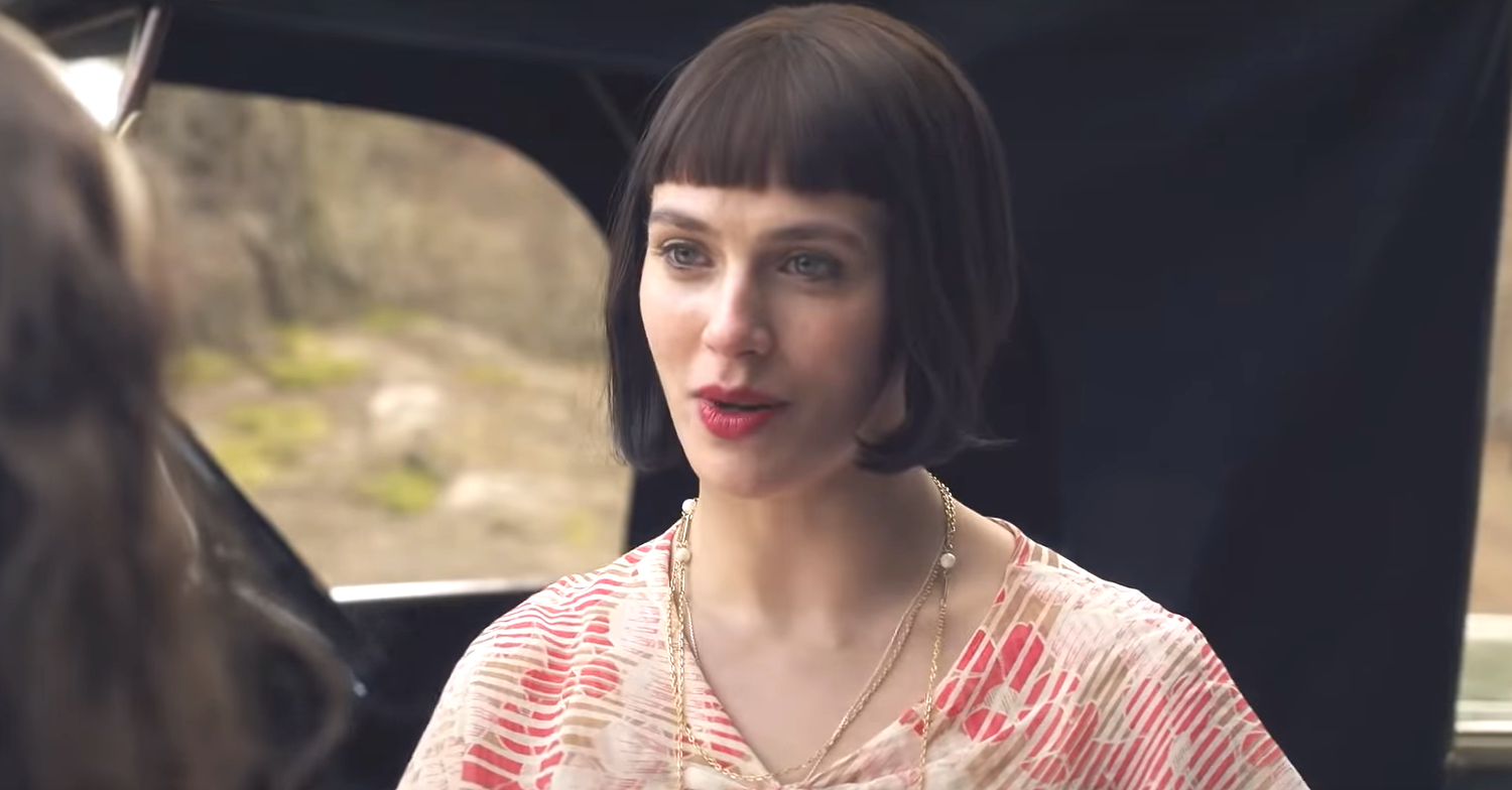 Intense socialite Izzie, played by Jessica Brown Findlay