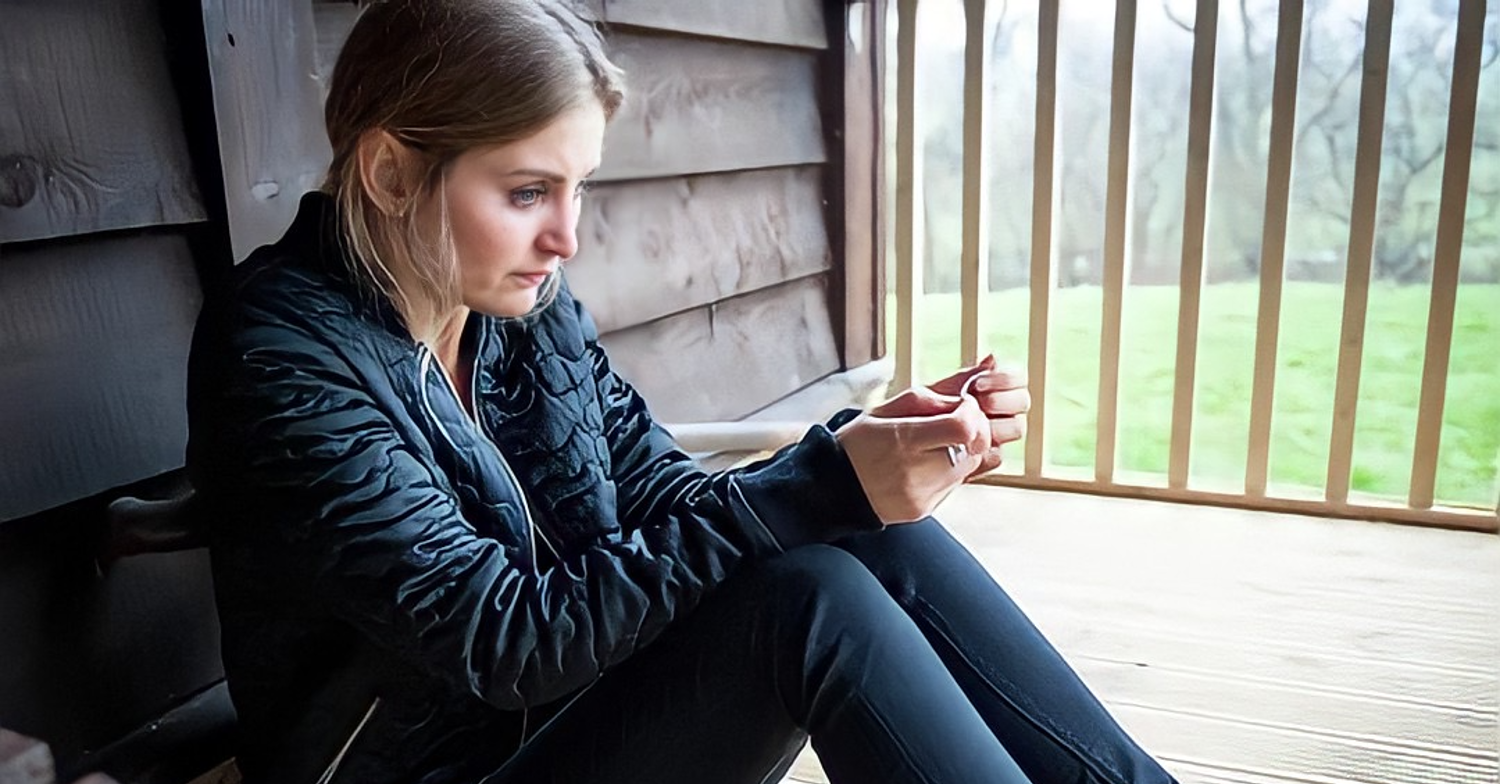 Emmerdale character Holly looking sad holding drugs