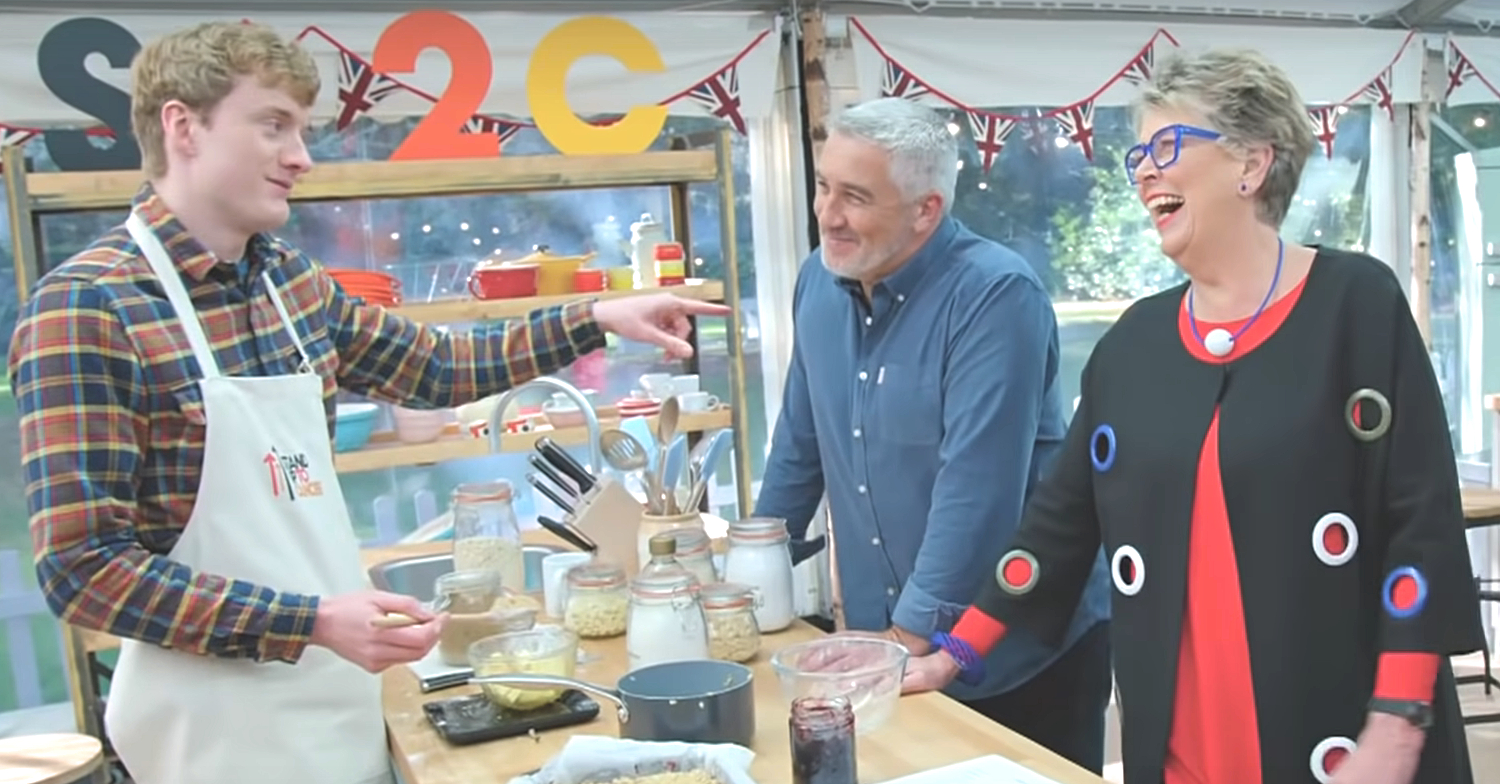 Paul and Prue laughing as James Acaster attempts to bake