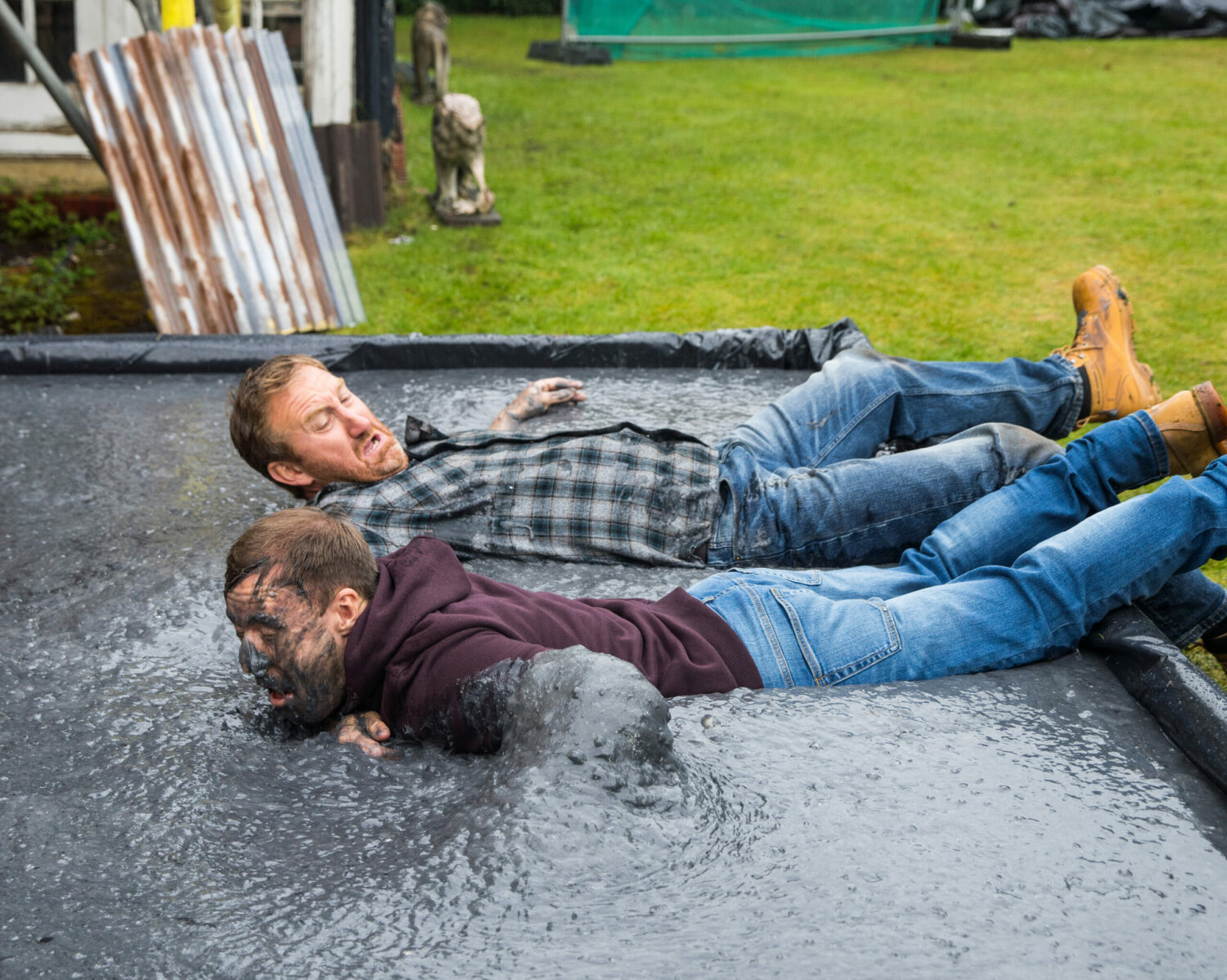 Coronation Street Phill and Tyrone fall into the wet cement after their fight