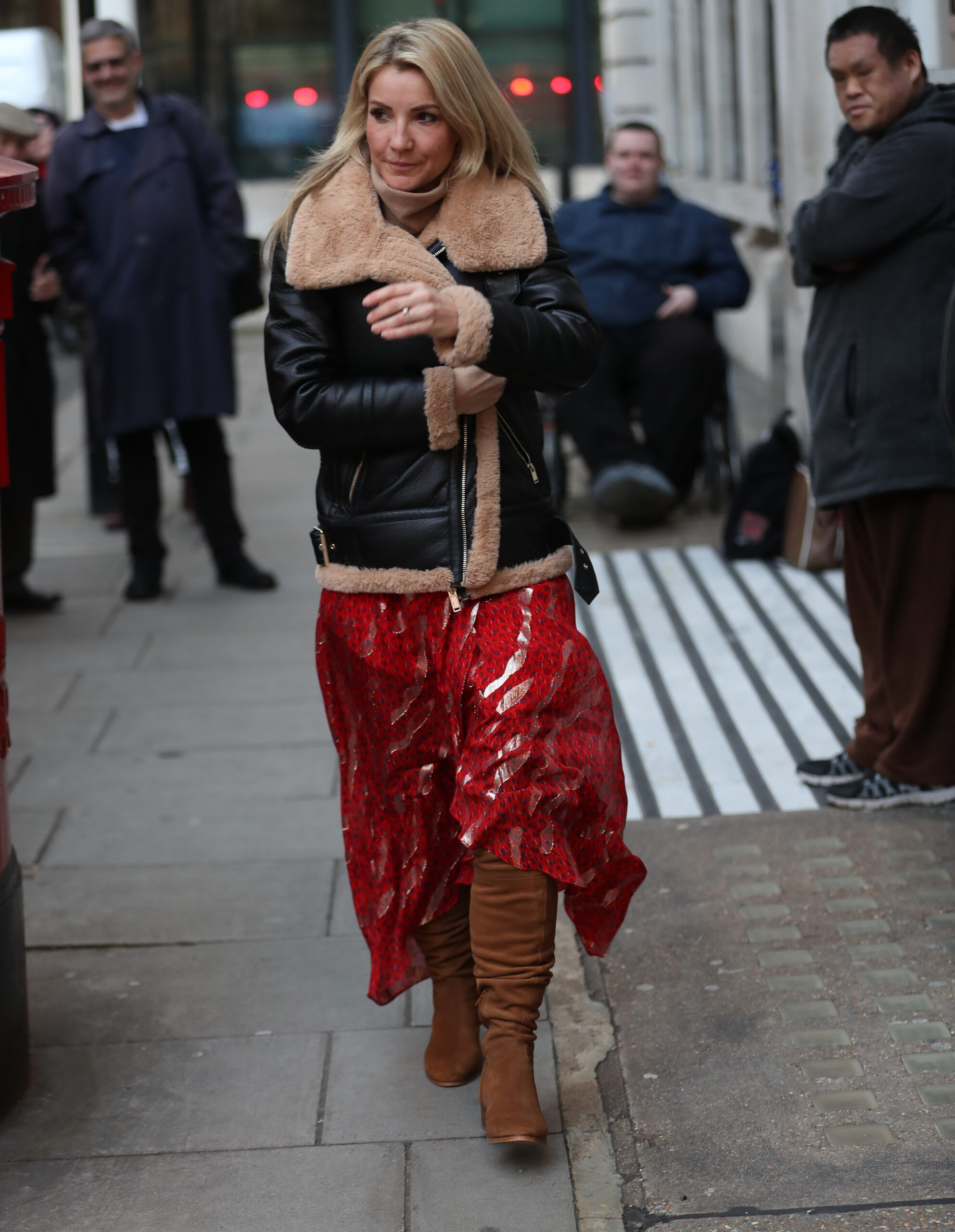 Helen Skelton in a red skirt scowling