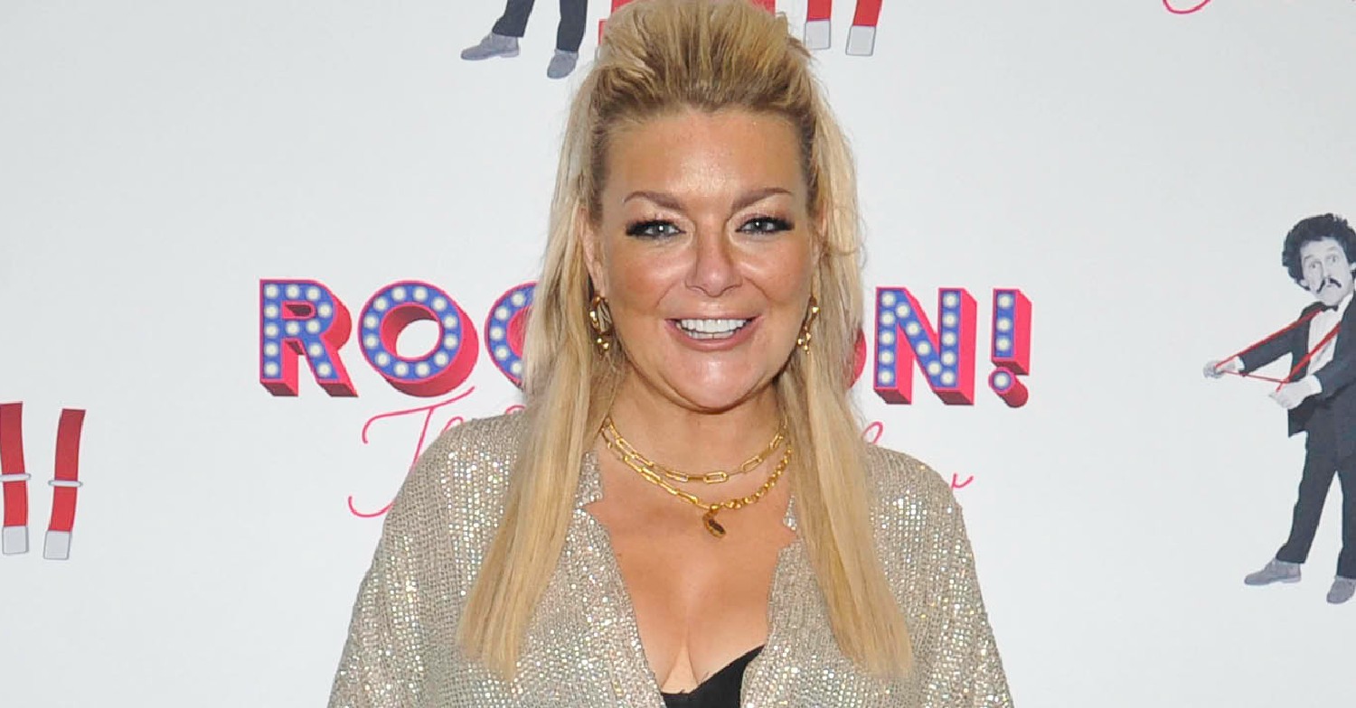 Sheridan Smith smiling on the red carpet, wearing a sequined dress 