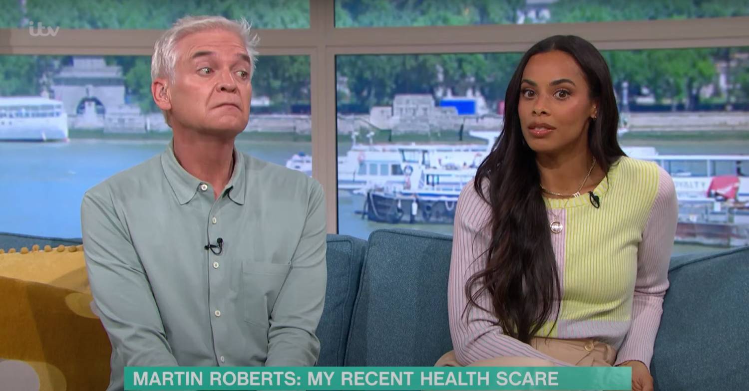 Phillip Schofield raises his chin, sitting with Rochelle Humes