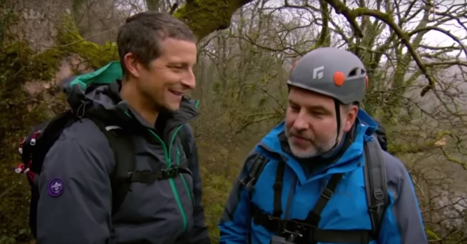 Bear Grylls smiling at David Walliams