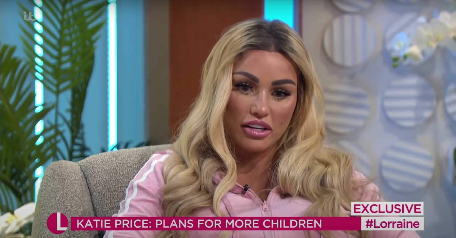 Katie Price, in a pink tracksuit, looking down on Lorraine