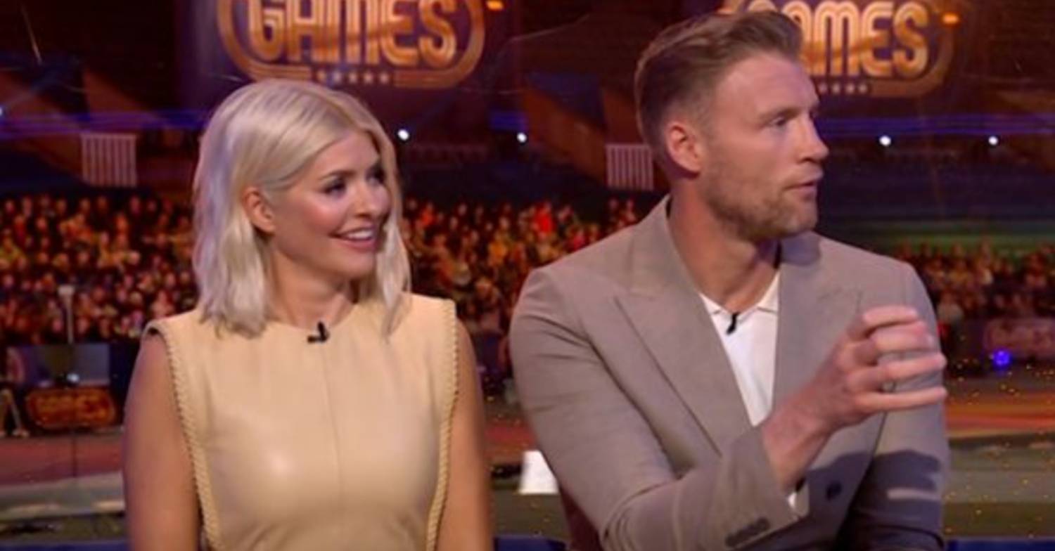 Freddie Flintoff mimics holding a javelin