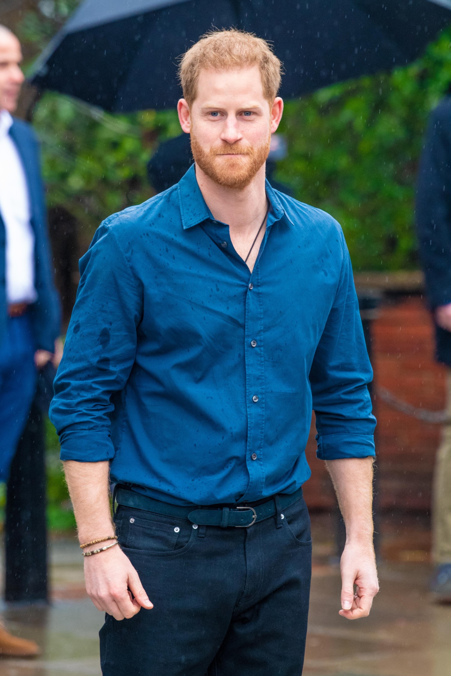 Prince Harry in a blue shirt on a royal engagement