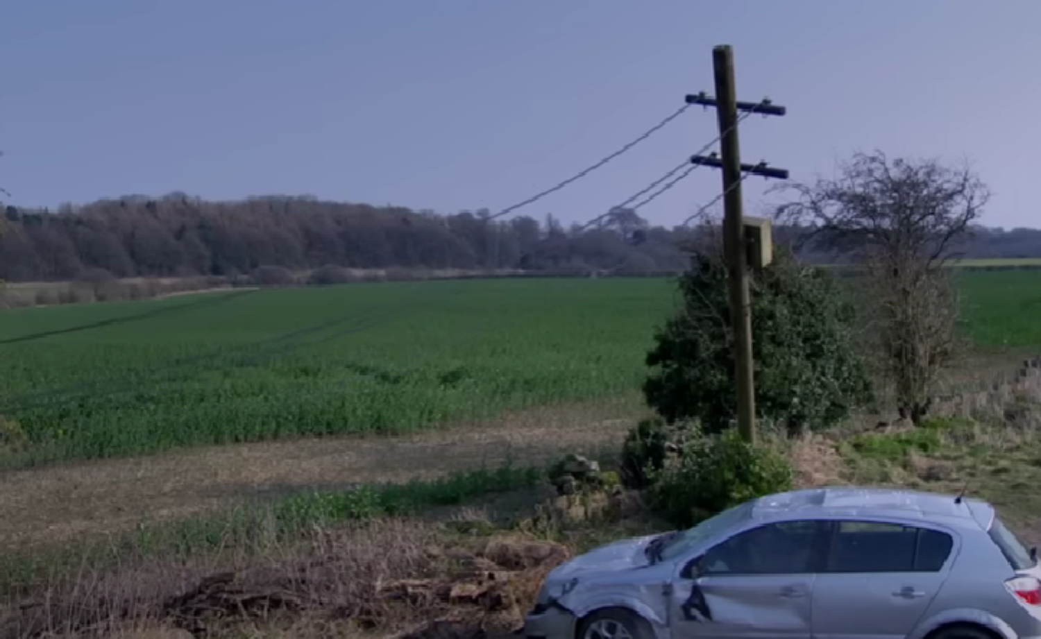 Cain's car under a utility pole in Emmerdale