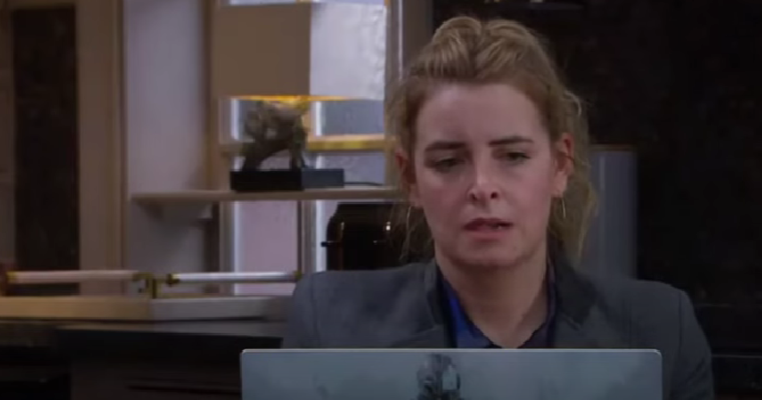 Charity looking at Noah's laptop in Emmerdale 