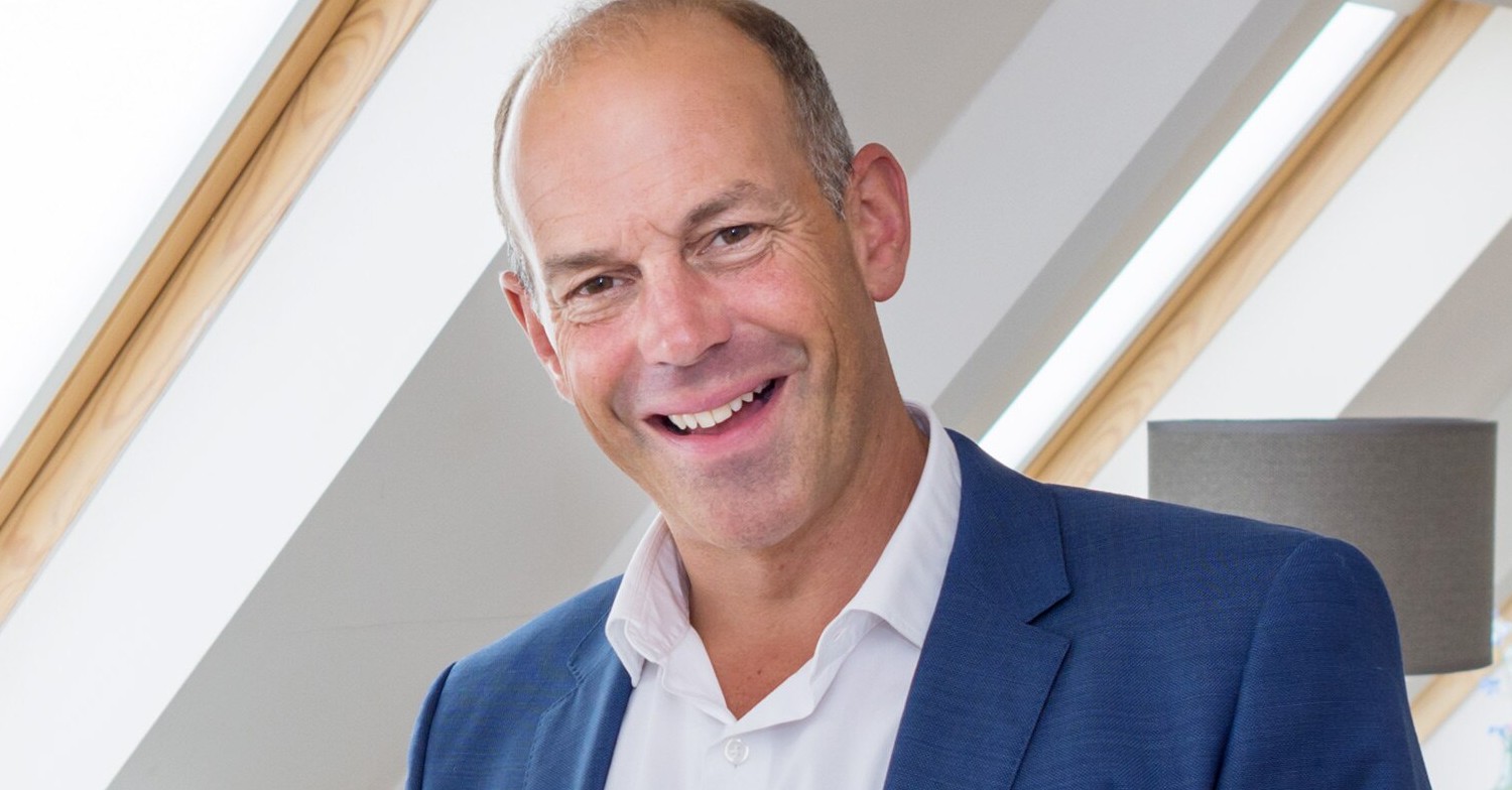 Phil Spencer smiling on a promo shot for Location, Location, Location