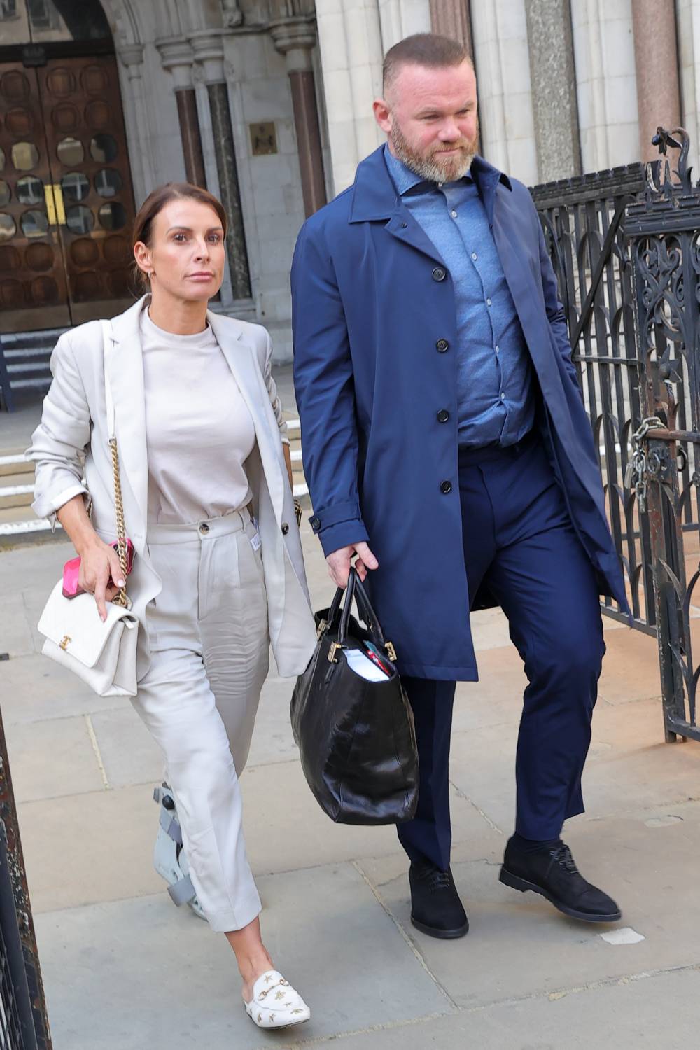 Coleen Rooney and Wayne Rooney arrive at court for day four of the Wagatha Christie trial