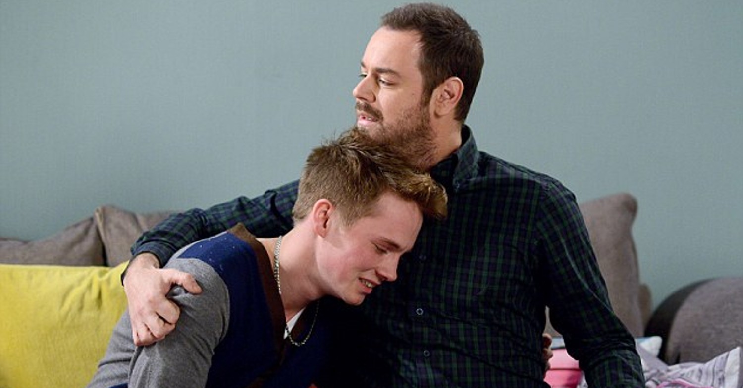 Sam Strike cuddling EastEnders co-star Danny Dyer on the soap