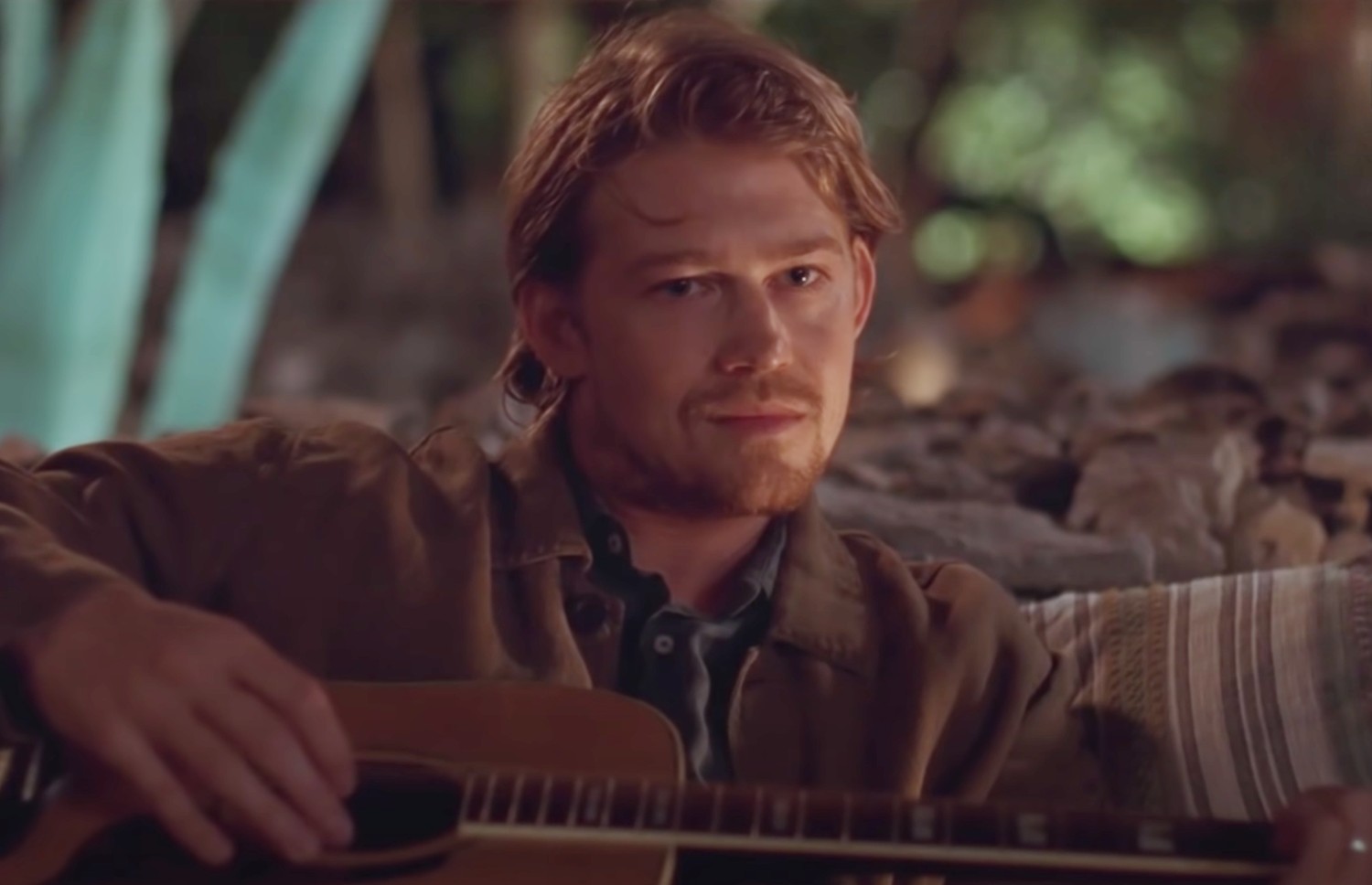 Joe Alwyn playing the guitar in Conversations with Friends
