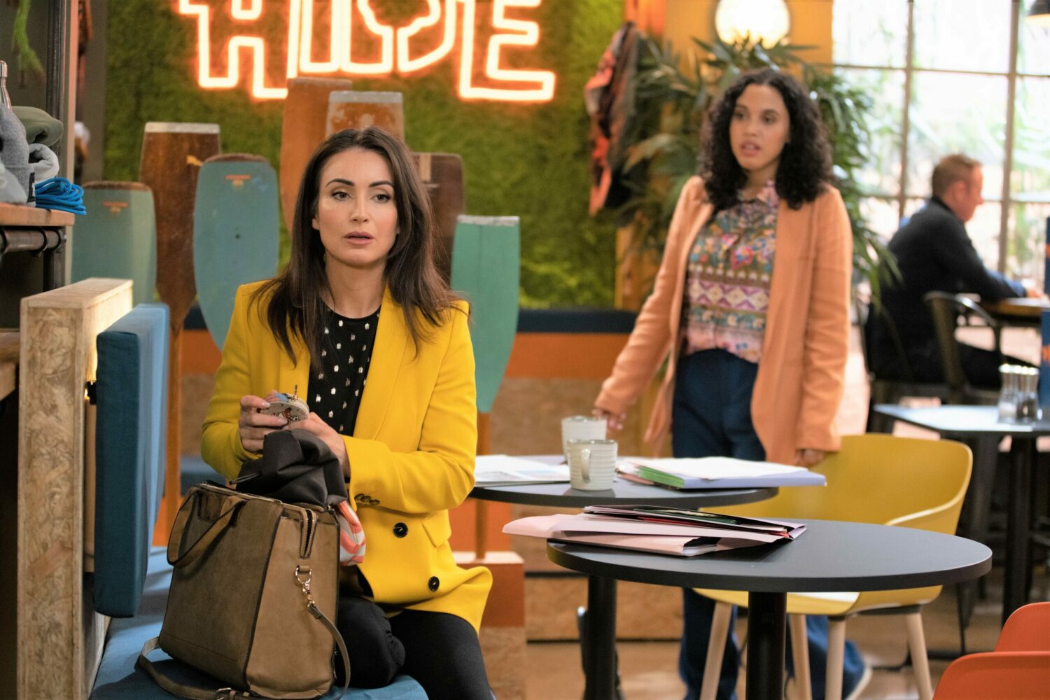 Emmerdale Leyla looking suspicioous and Suzy looking annoyed